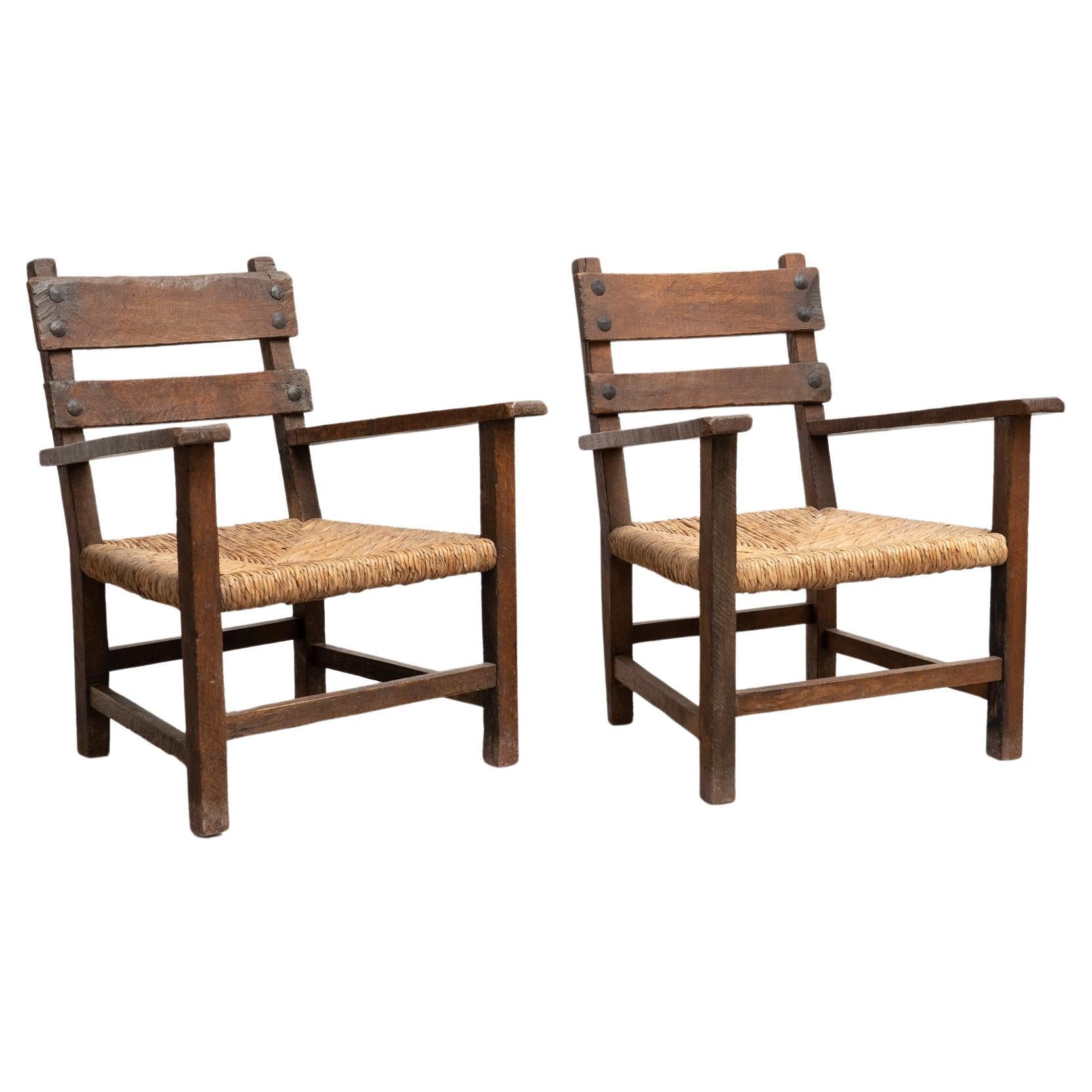Set of Two Rustic Early 20th Century Armchairs in Solid Wood and Rattan For Sale