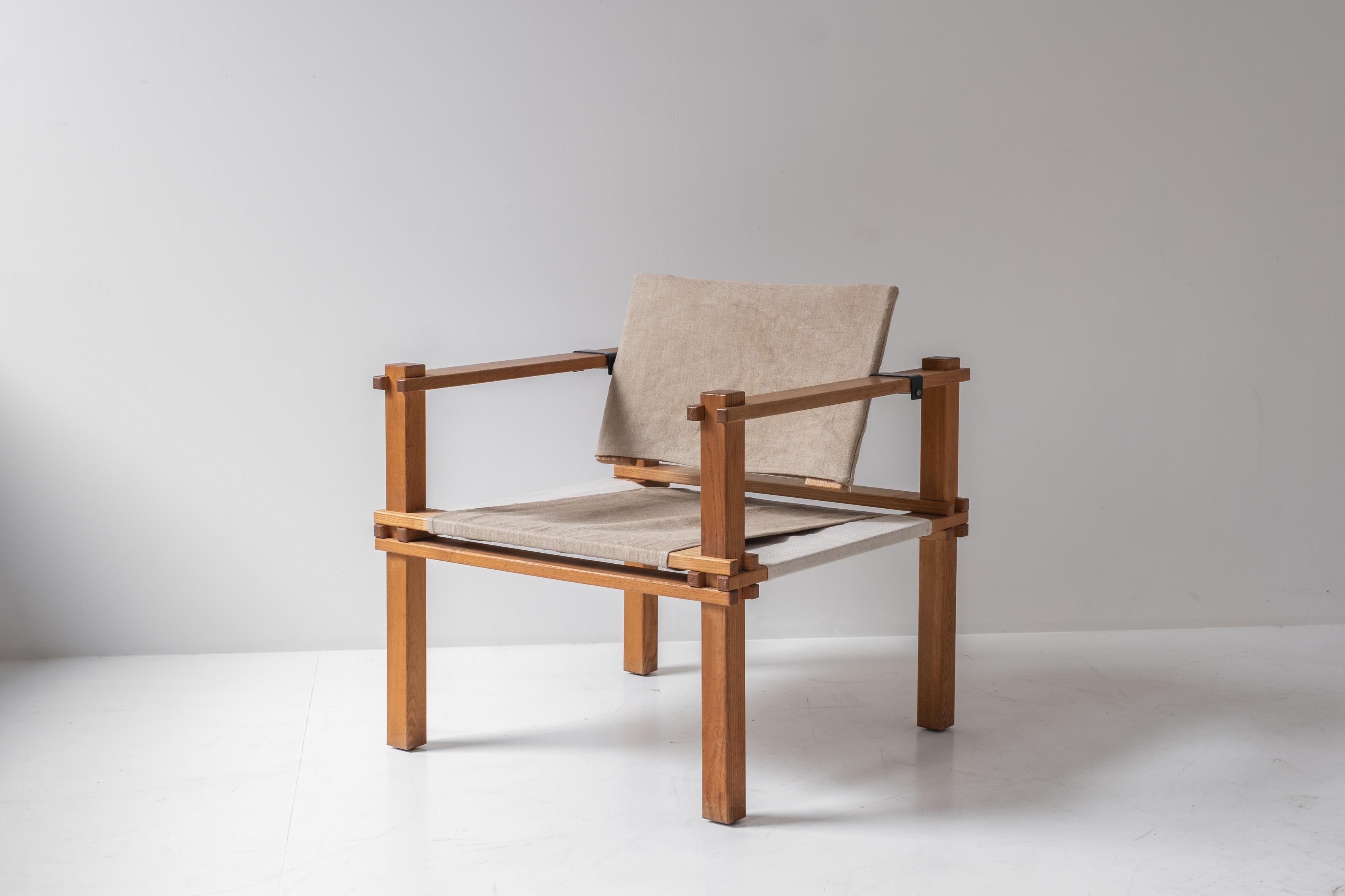 Set of two Safari easy chairs by Gerd Lange for Bofinger, Germany 1960s. These chairs feature oak frames and linen seats and backs. These architectural chairs are set up with only wooden elements, no screws where used to assemble.