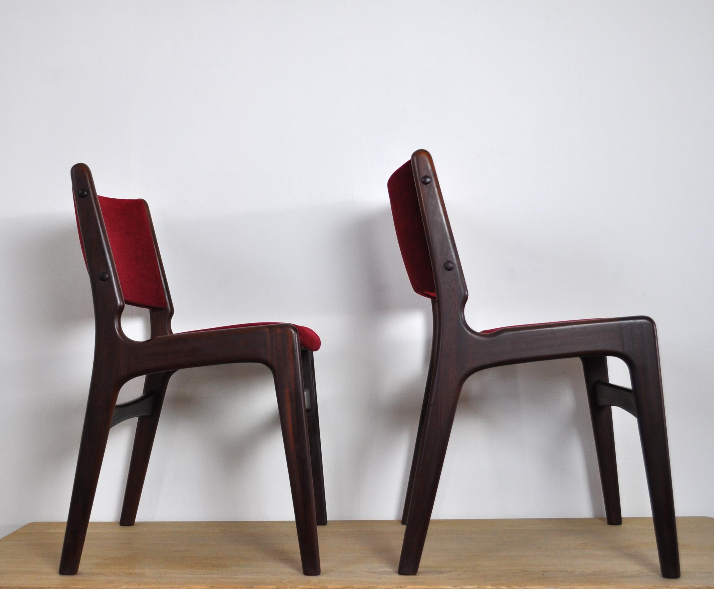 Set of two dining chairs designed by Erik Buch for Oddense Maskinsnedkeri.
Solid teak frames with fabric upholstered seats and backs in a good condition.
 