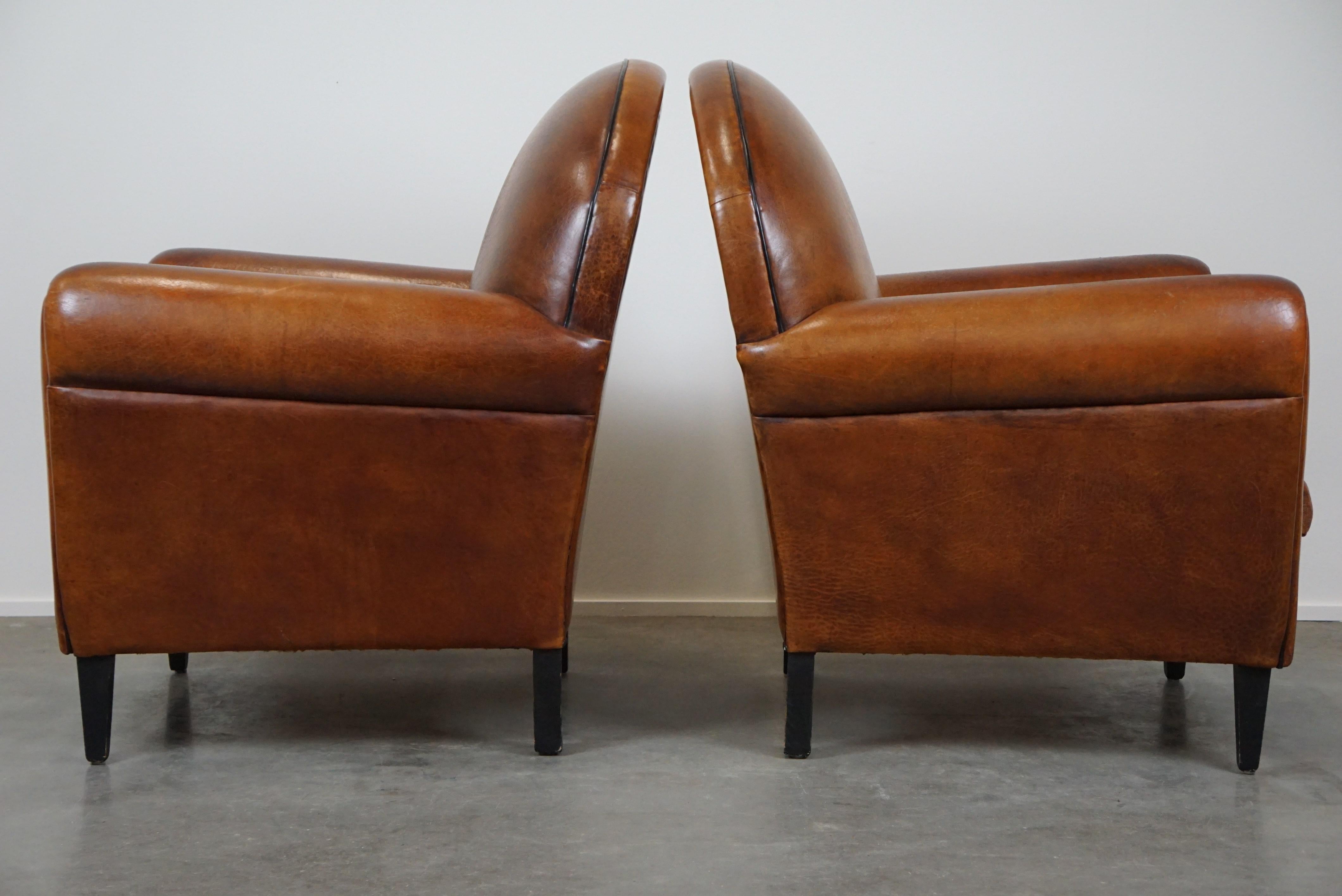 Late 20th Century Set of two sheep leather Art Deco style design armchairs with a beautiful patina For Sale