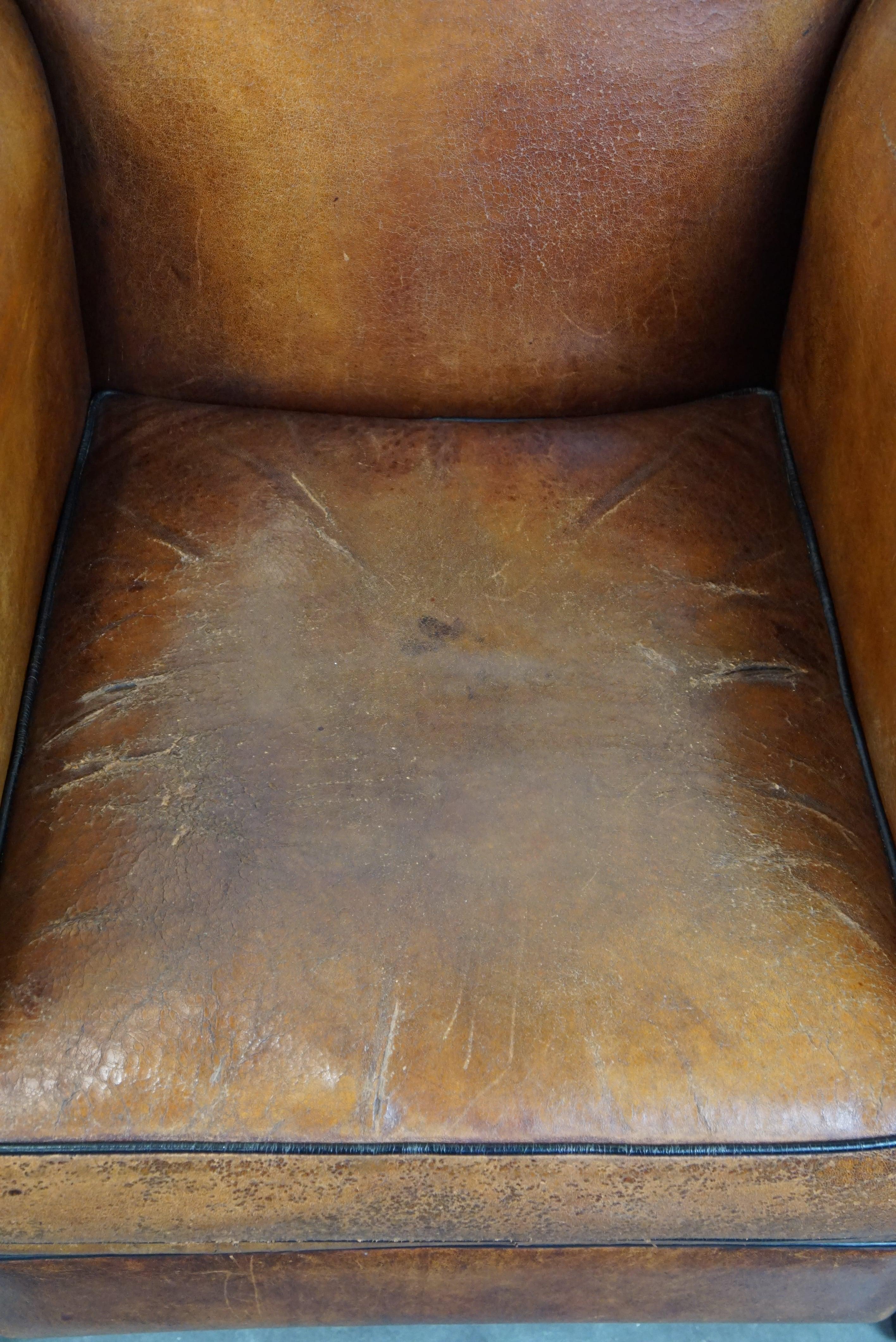 Leather Set of two sheep leather Art Deco style design armchairs with a beautiful patina For Sale