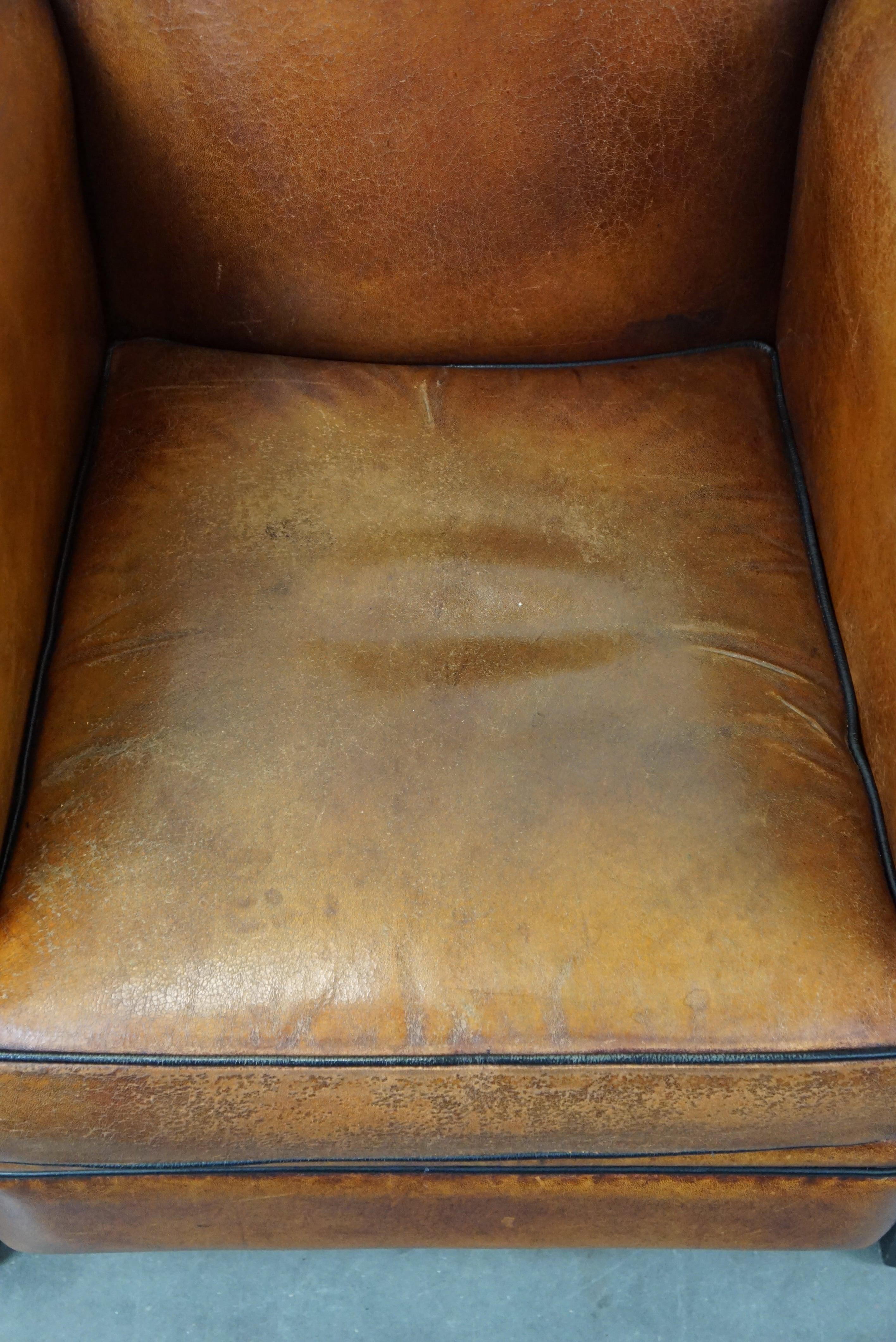Set of two sheep leather Art Deco style design armchairs with a beautiful patina For Sale 1
