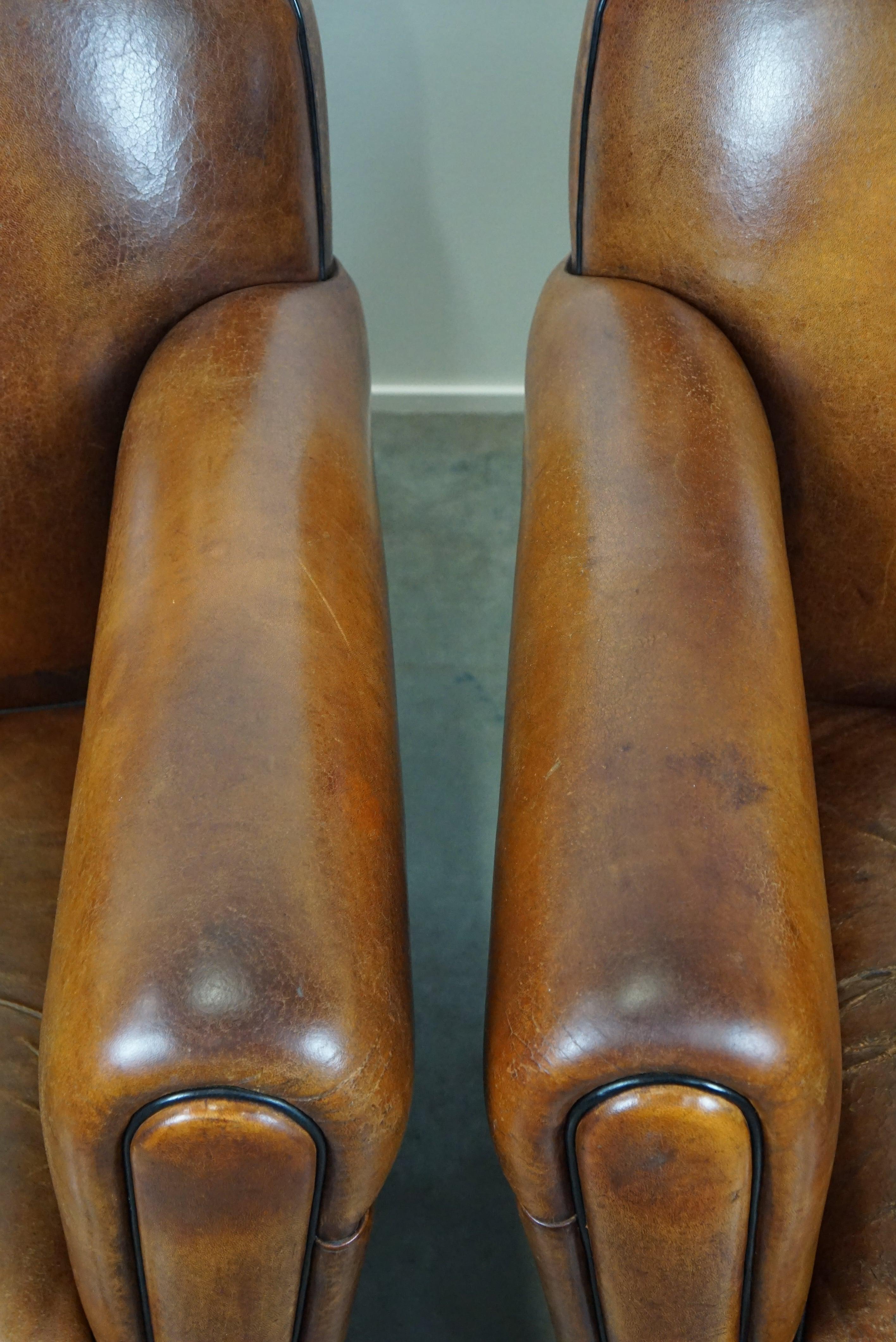 Set of two sheep leather Art Deco style design armchairs with a beautiful patina For Sale 3