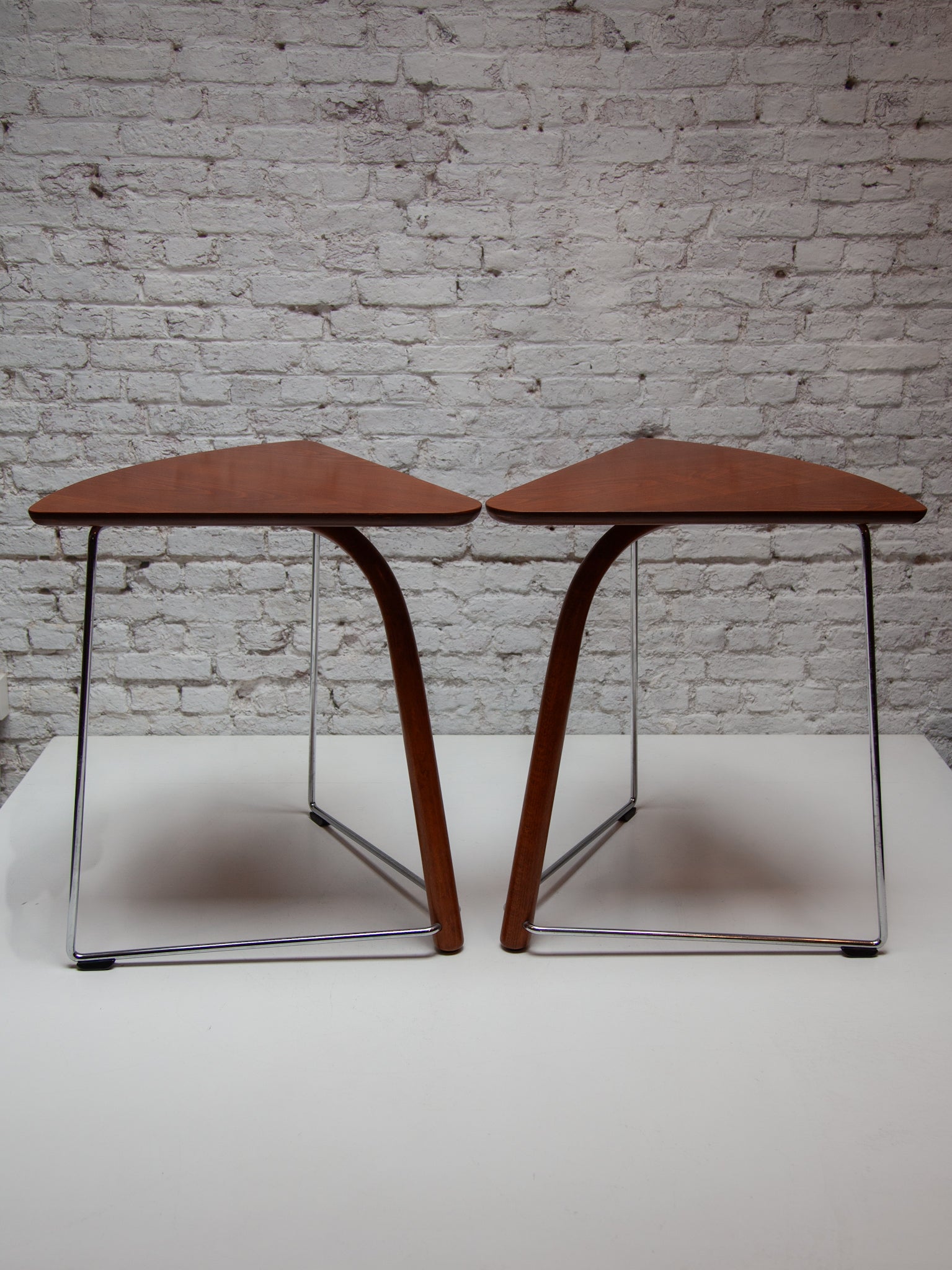 Set of two Thonet side tables designed by Wulf Schneider and Ulrich Böhme to match their S320 chair featured a steam bent wood front leg , inspired by Thonet’s long tradition of steam bent furniture combined with chromed bar steel back legs and