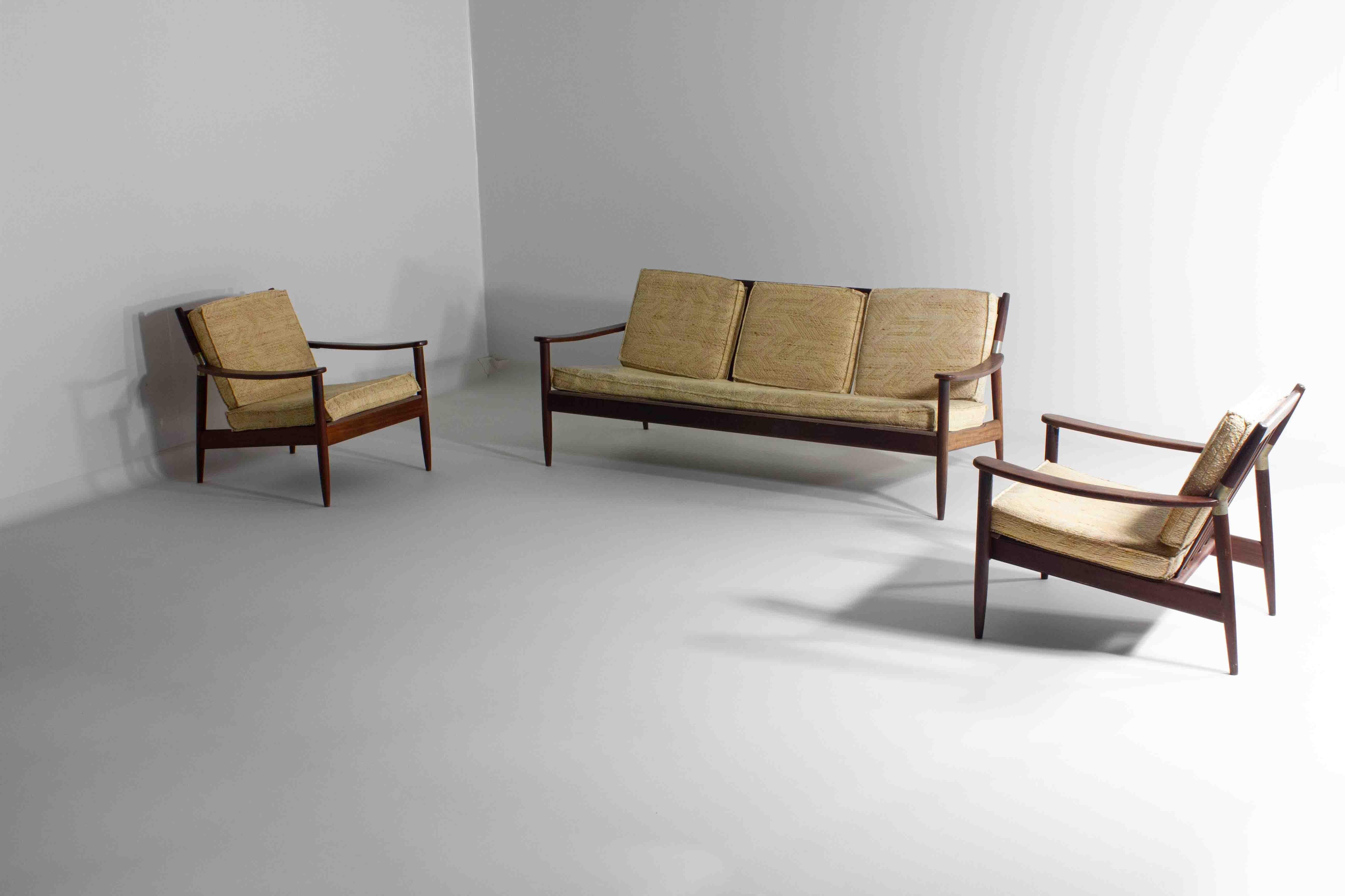 This set of mid-century Scandinavian lounge chairs is a paragon of the design principles that have made this style an enduring influence in interior design. It features a streamlined, low-profile teak frames that showcase a rich, warm patina and a