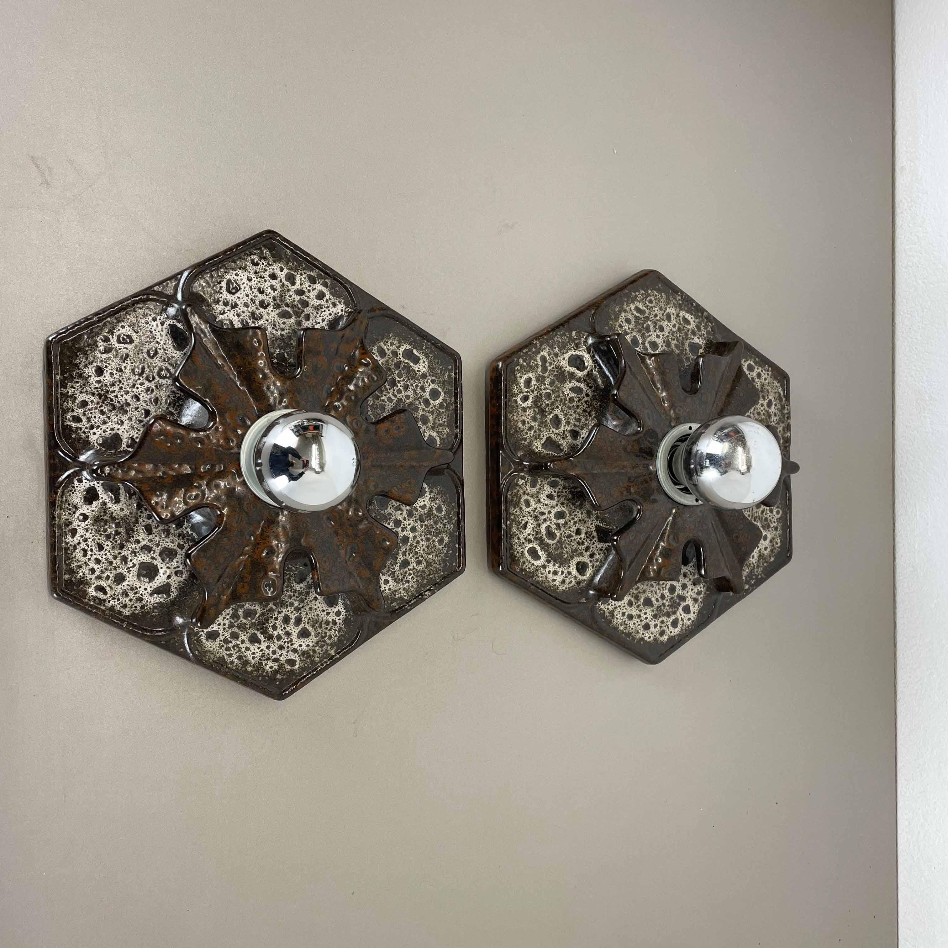 Article:

Wall light sconce set of two.


Producer:

Pan Ceramic, Germany.



Origin:

Germany.



Age:

1970s.



Description:

Original 1960s modernist German wall light made of ceramic in fat lava optic. This super rare