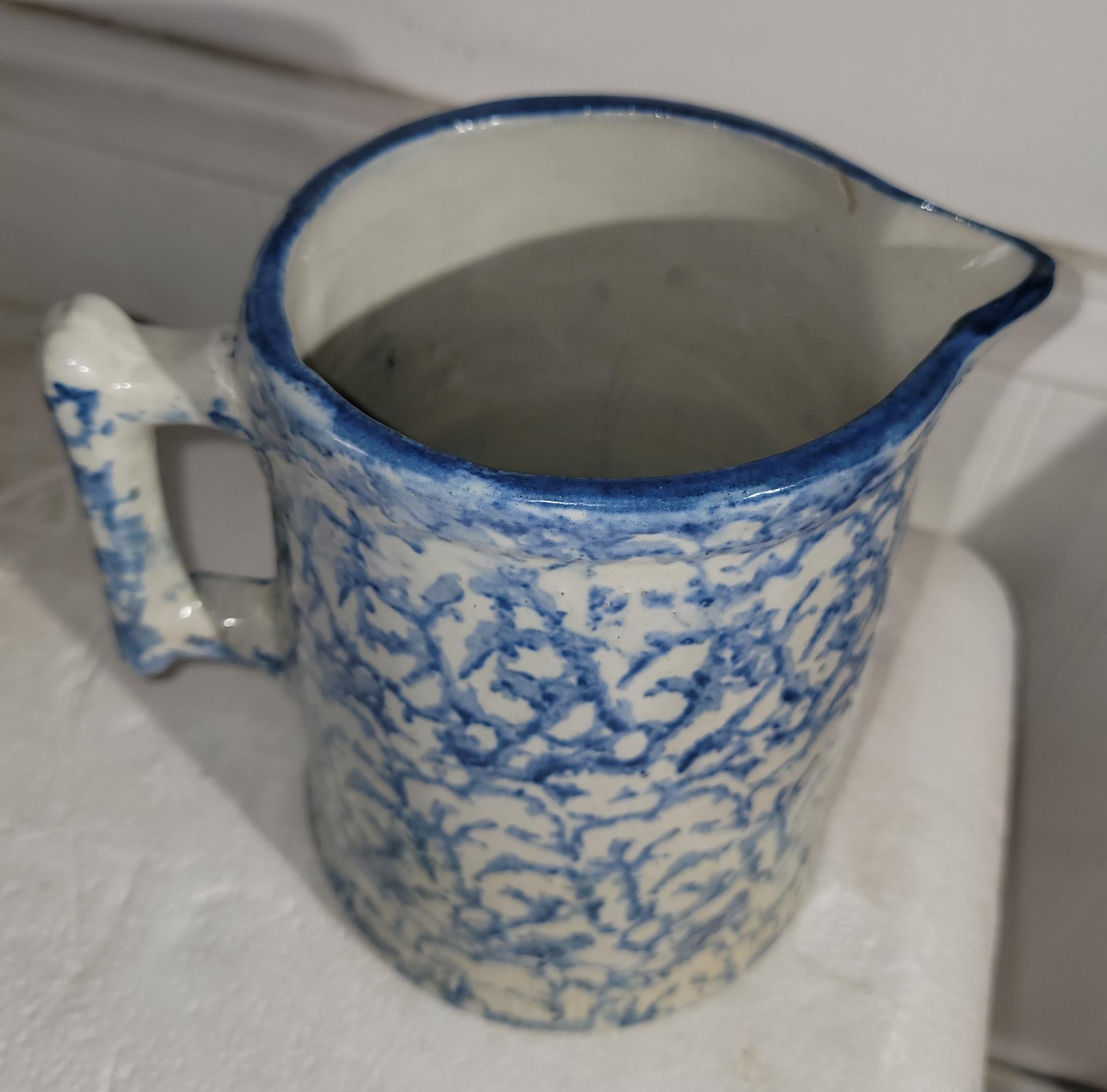 Pottery Set of Two Sponge Ware Pitchers For Sale