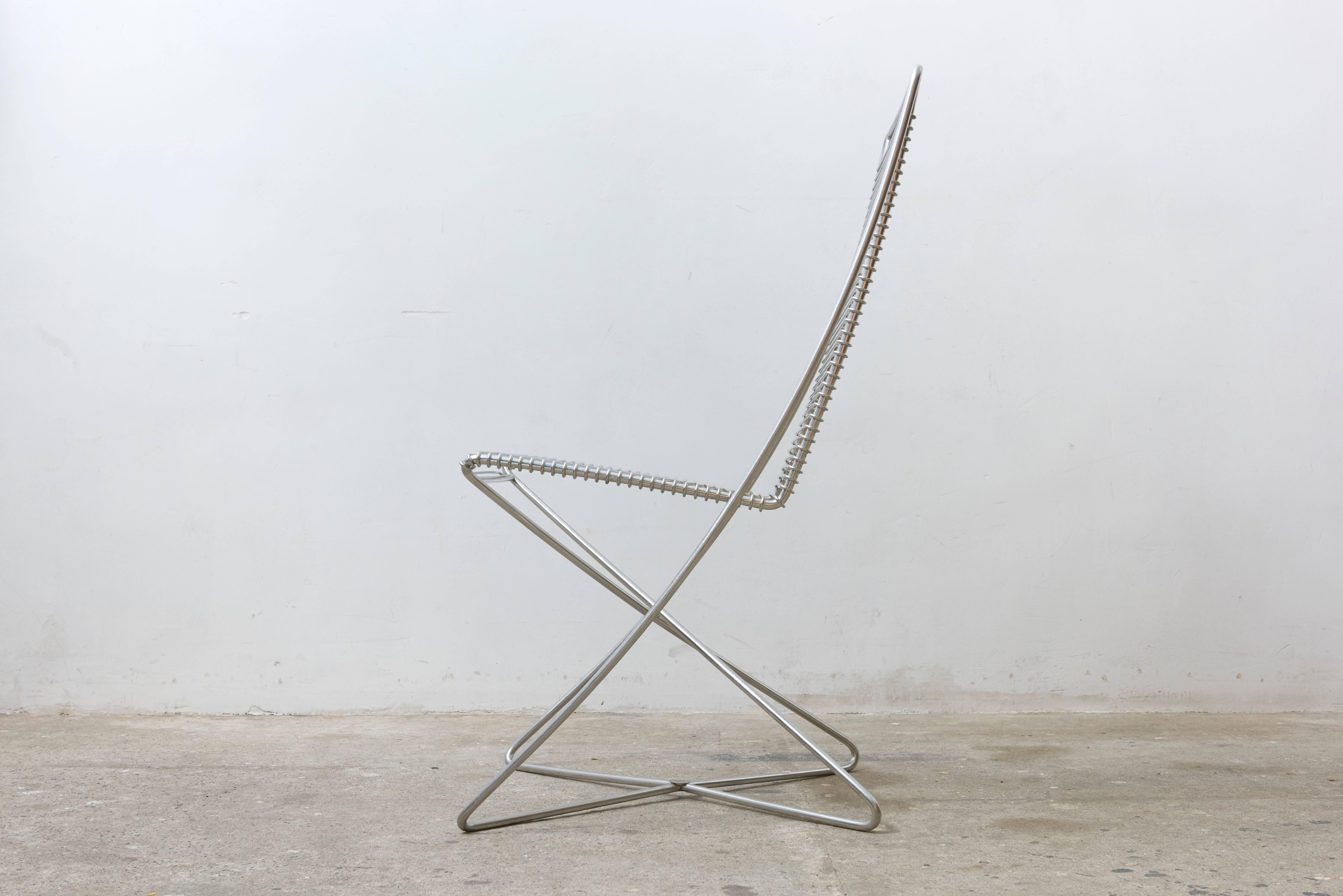 Beautiful set of two chairs were made of chromed steel wire and are named Kreuzschwinger.
They are medically, ergonomically designed and labelled by Till Behrens for Schlubach, Germany. 
 
The Kreuzschwinger forces not static, but a dynamic posture