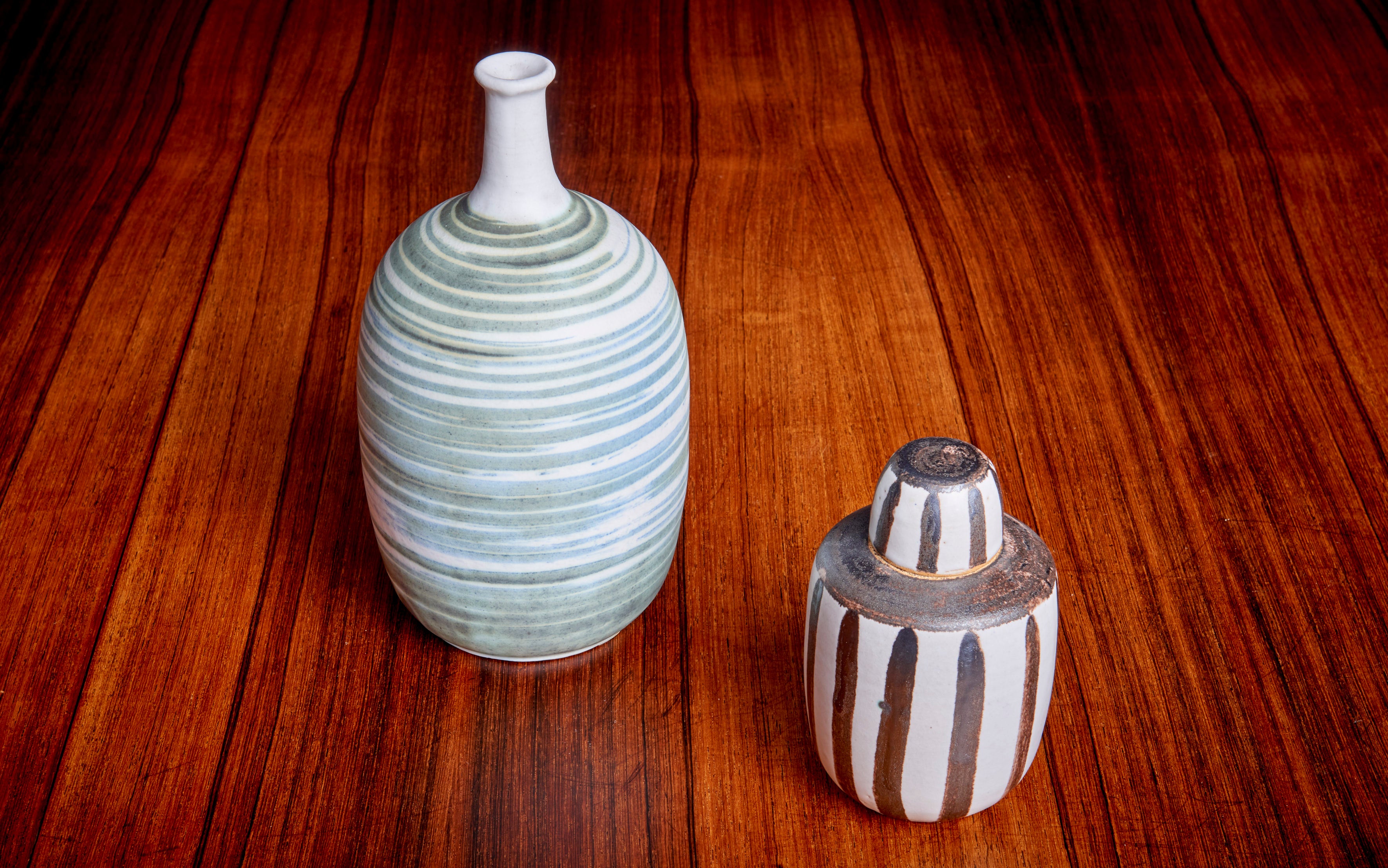 Mint set of of two ceramic vases by Ahsltrom.
Very nice glaziers. The size is the bigger green striped one.

