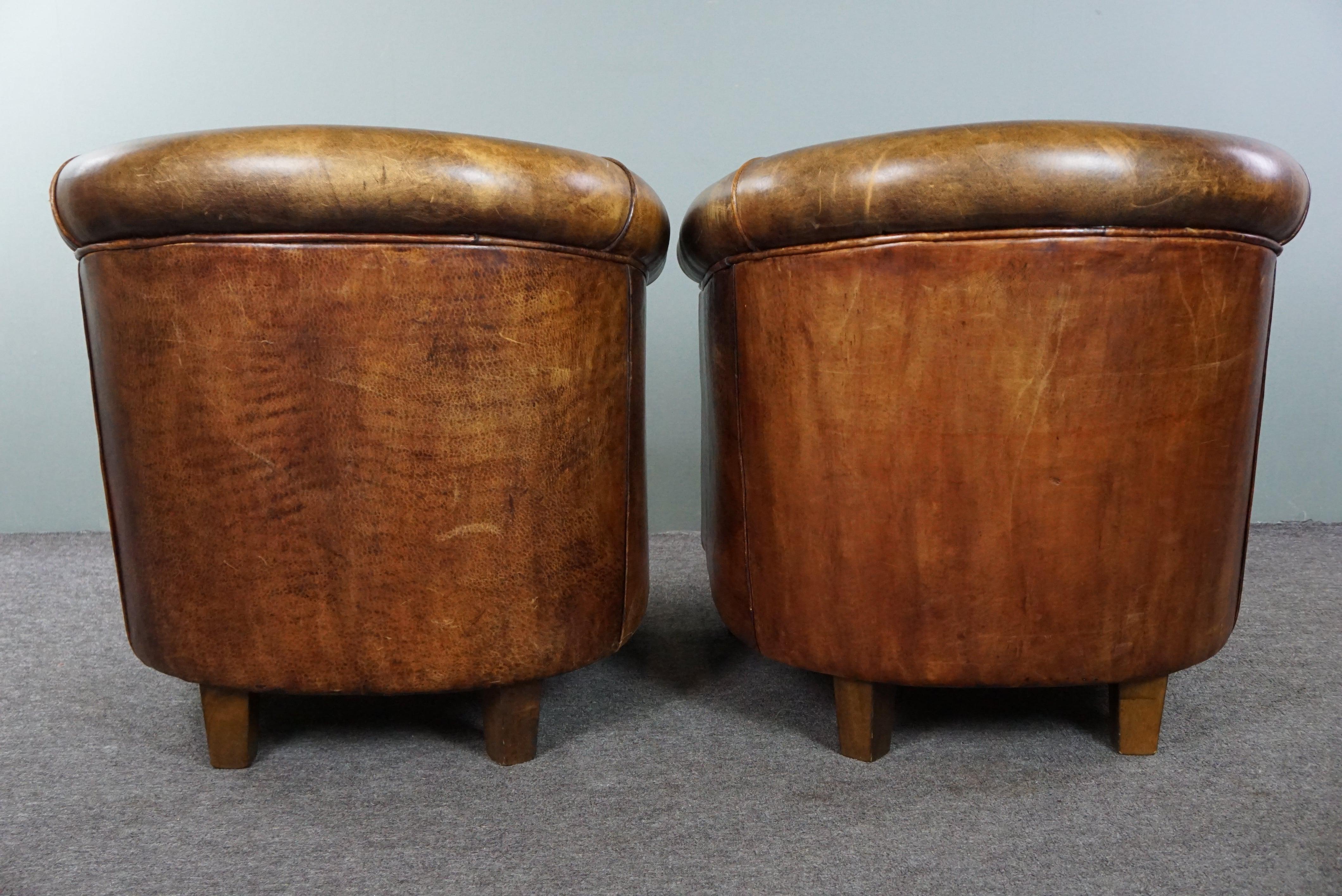 Hand-Crafted Set of two sturdy sheep leather club chairs, beautiful dark cognac color
