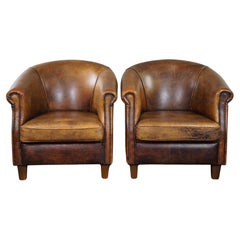 Set of two sturdy sheep leather club chairs, beautiful dark cognac color