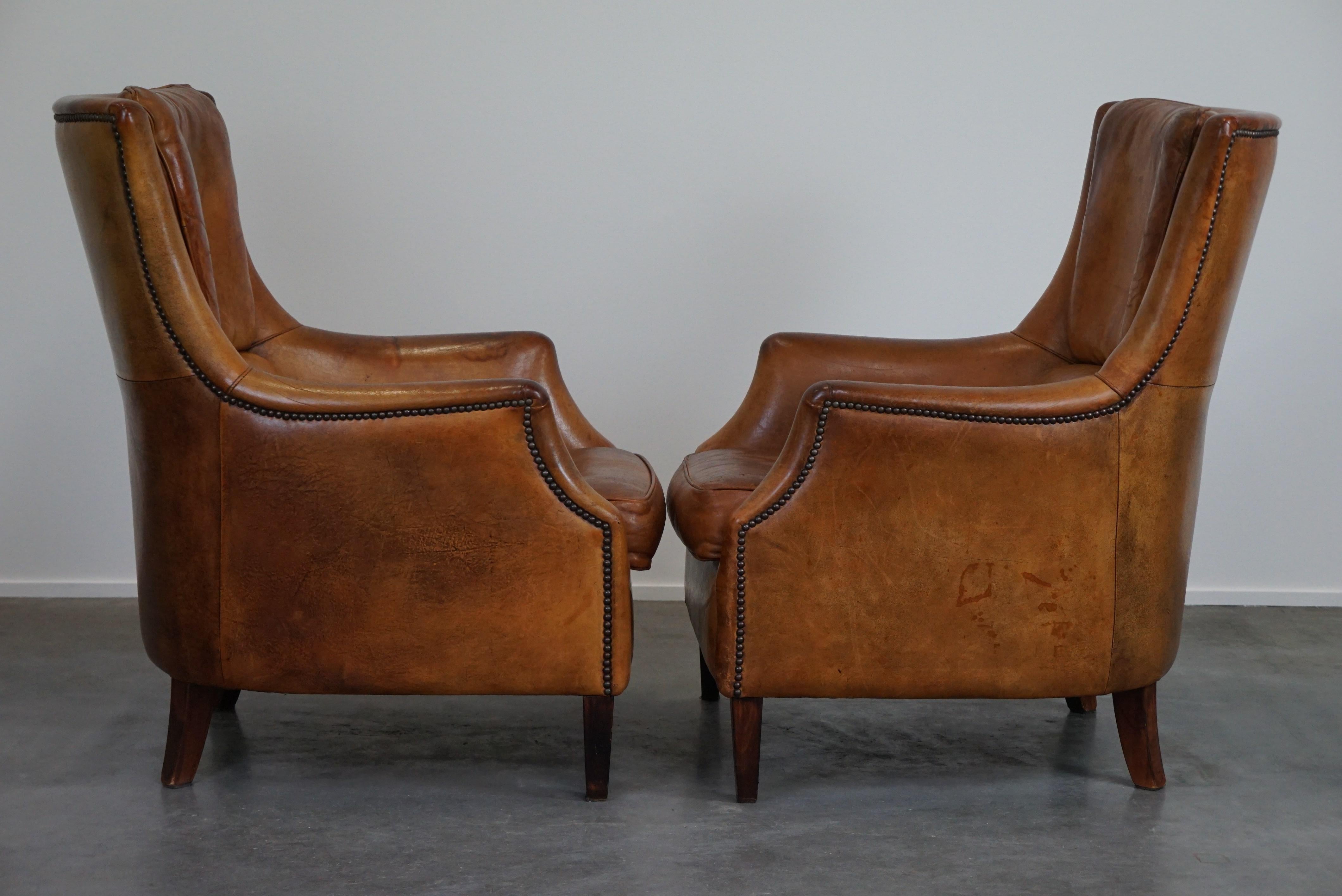 Dutch Set of two super rugged and very comfortable sheep leather armchairs. For Sale