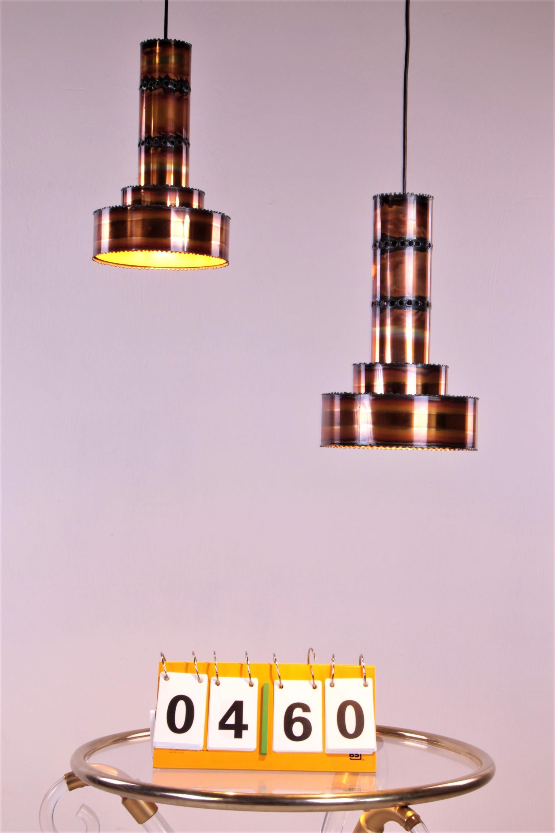 A beautiful set of two brutalist pendant lamps, 

designed by the Danish designer Svend Aage Holm-Sørensen.

He was known for the lamps he created for well-known 
Danish furniture companies and later for his own brand in the 1950s:
Holm