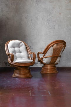 Set of two Swivel Rattan Armchairs with cushions and Coffee Table, Italy 1960s