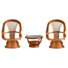 Set of two Swivel Rattan Armchairs with cushions and Coffee Table, Italy 1960s