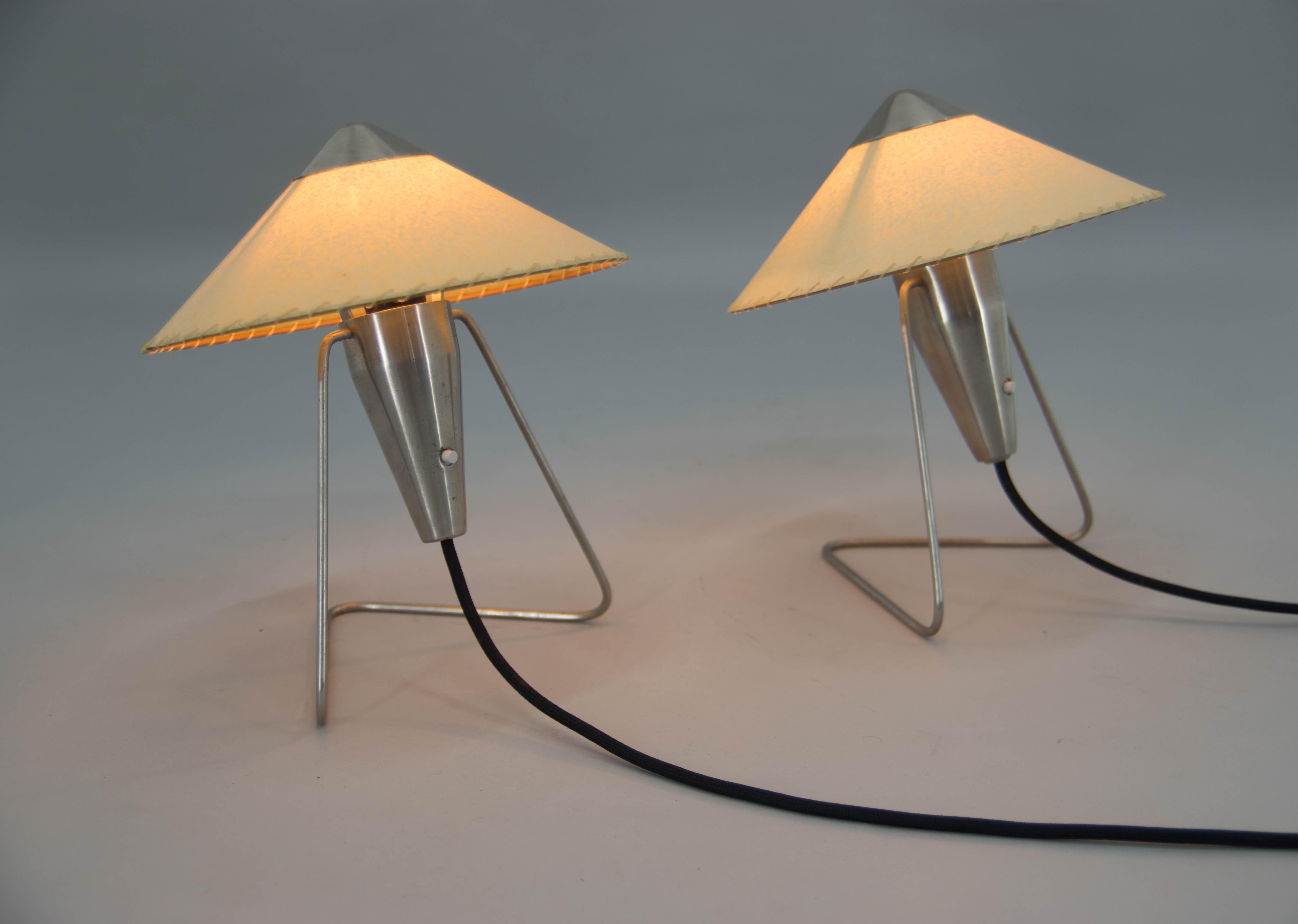 Pair of table or wall lamps designed by Helena Frantova for OKOLO, Czechoslovakia. Cleaned and polished. New parchment paper shades. Rewired: 1x40W, E12-E14 bulb.
US plug adapters included.