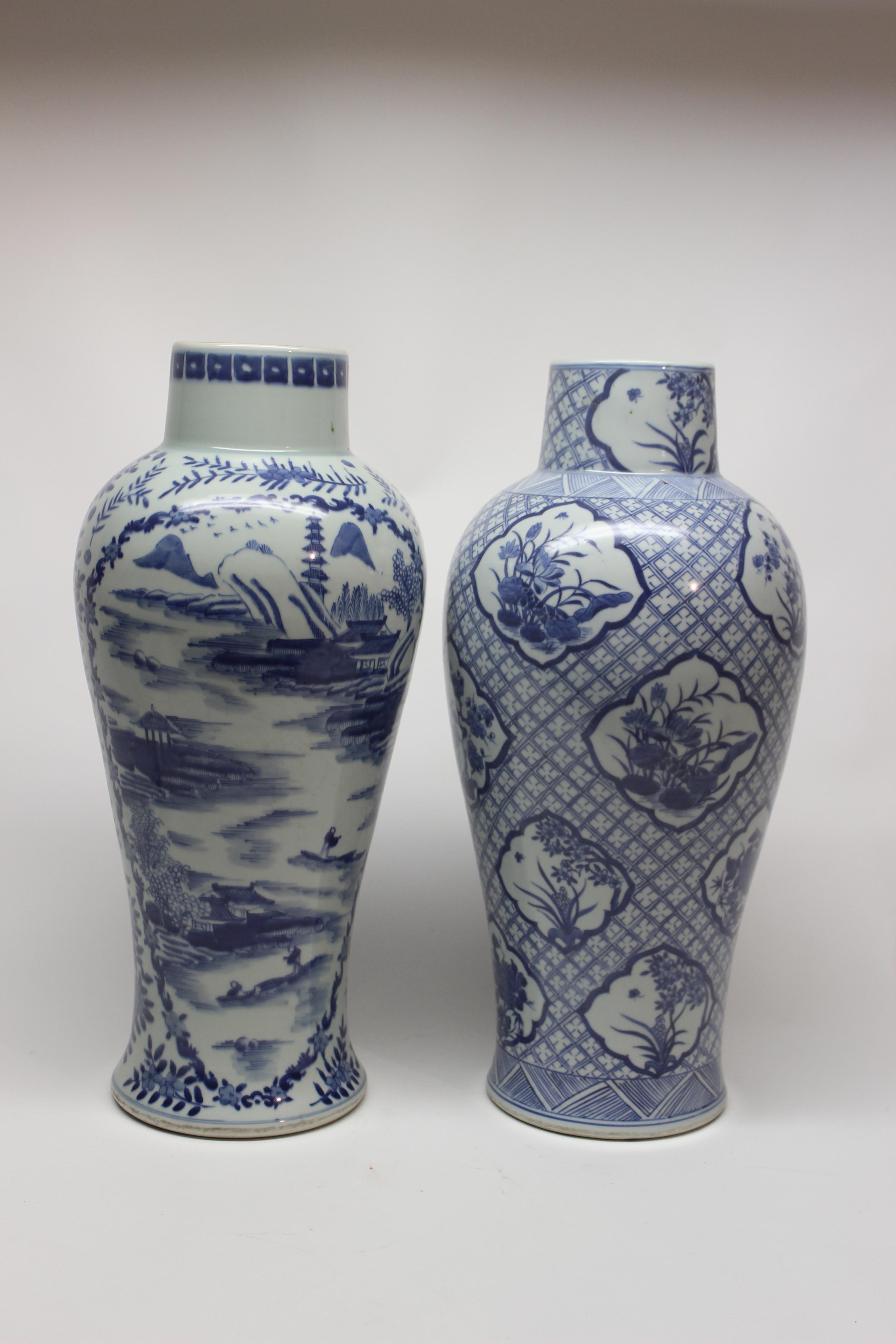 Set of two tall Chinese blue and white ceramic vases.