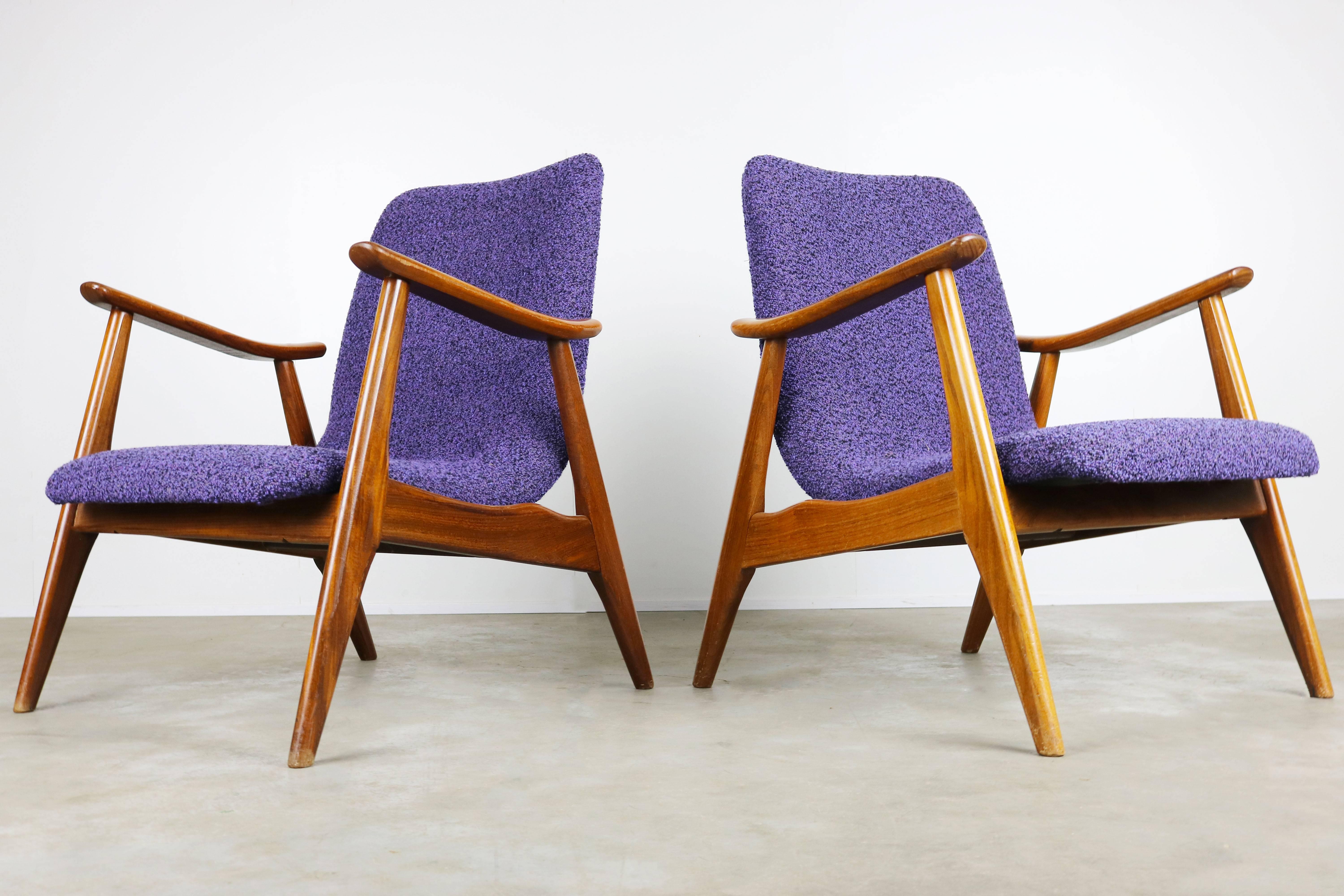 Wonderful set of two teak lounge chairs designed by Dutch Designer Louis Van Teeffelen for Webe, 1960. Sculpted teak frame with Minimalist seat. Very comfortable and stylish. new upholstery in a purple/black wool (see close ups), little traces of