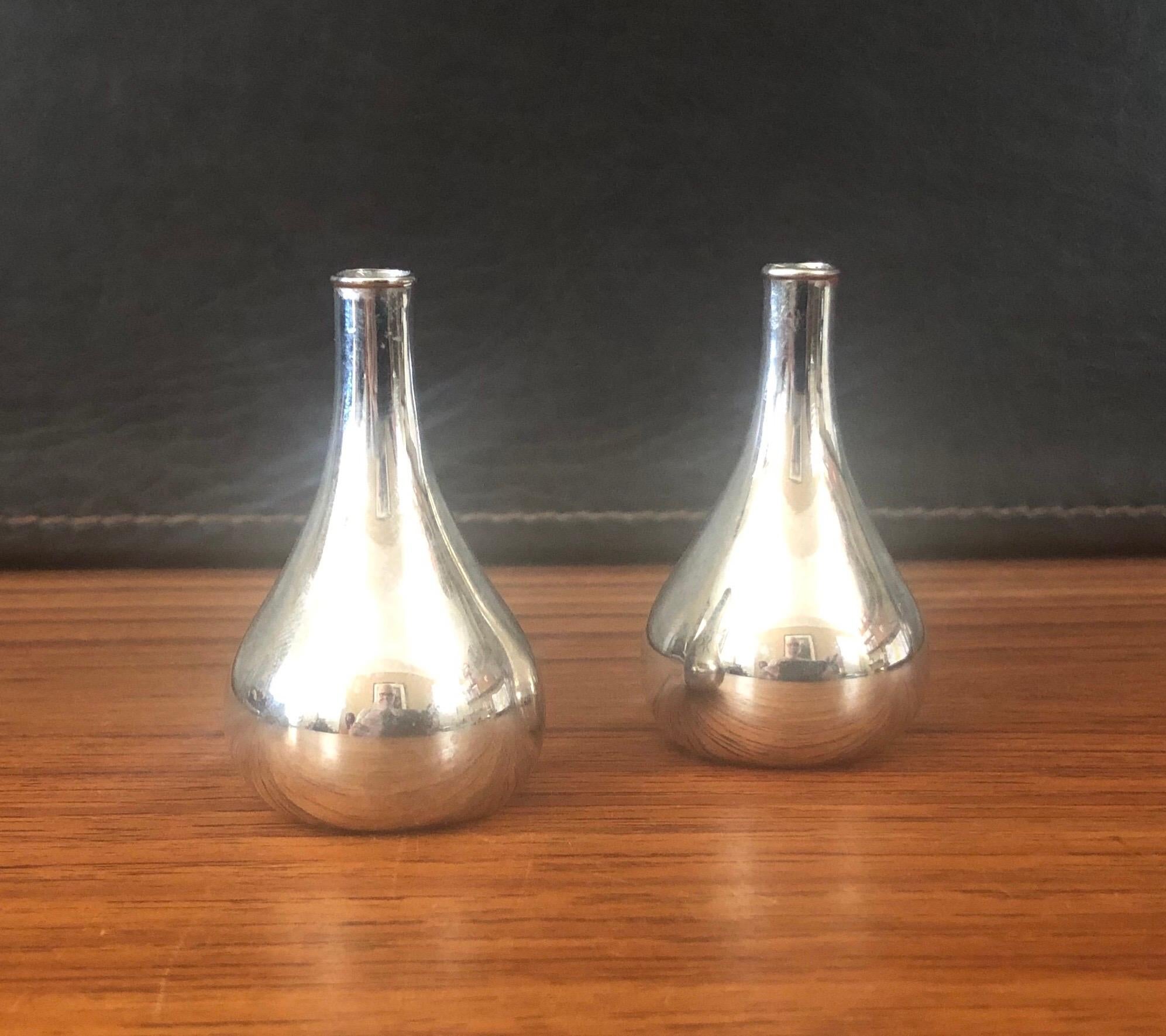 Set of four tear drop candleholders by Jens Quistgaard for Dansk, circa 1990s. They are made of silver plate over metal and support a .25