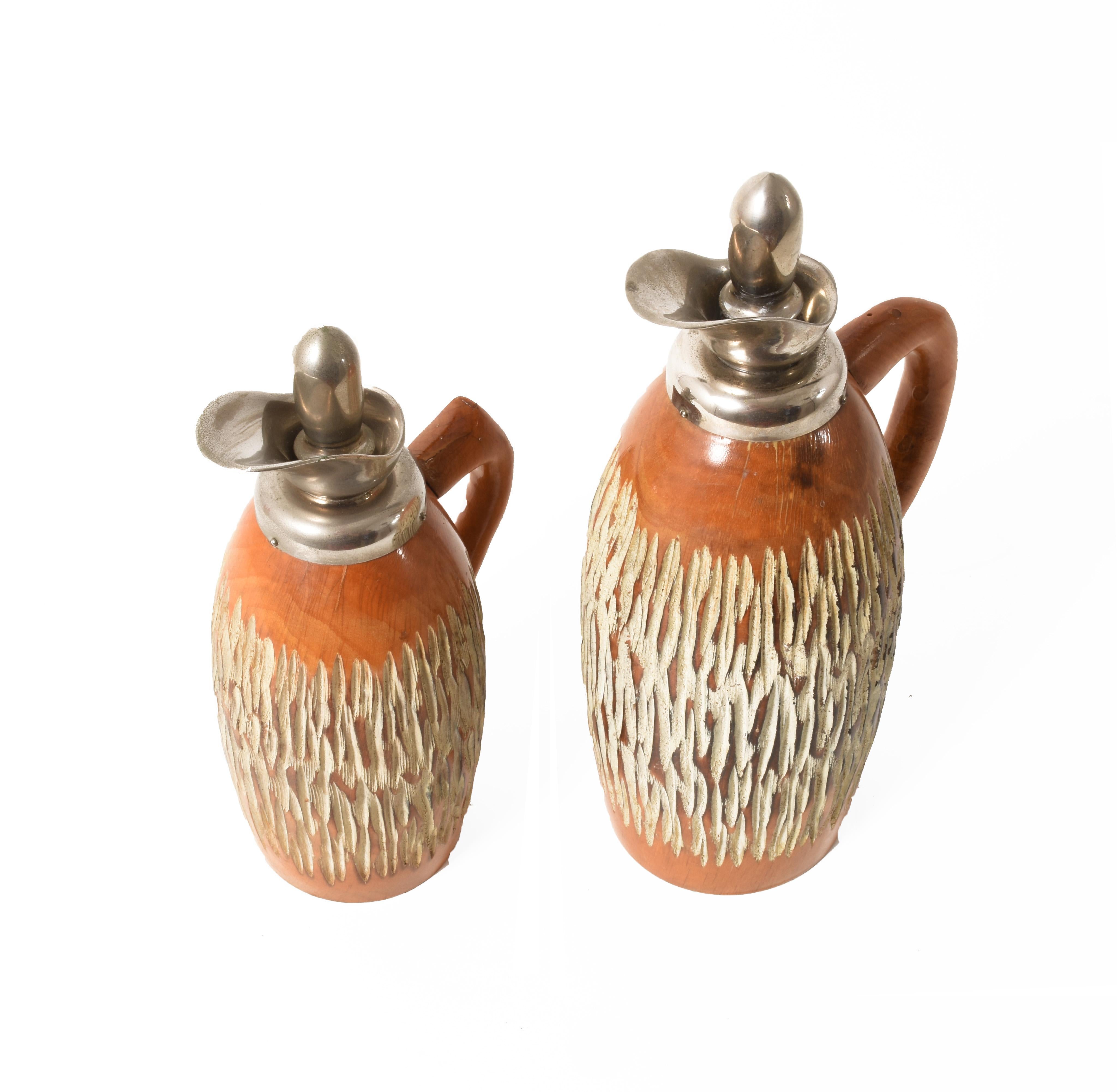 Set of two Thermos by Aldo Tura for Macabo Cusano Milanino, Milan, Italy, 1950s in carved wood
Measures: 31 x 17 cm
25 x 13 cm.
 