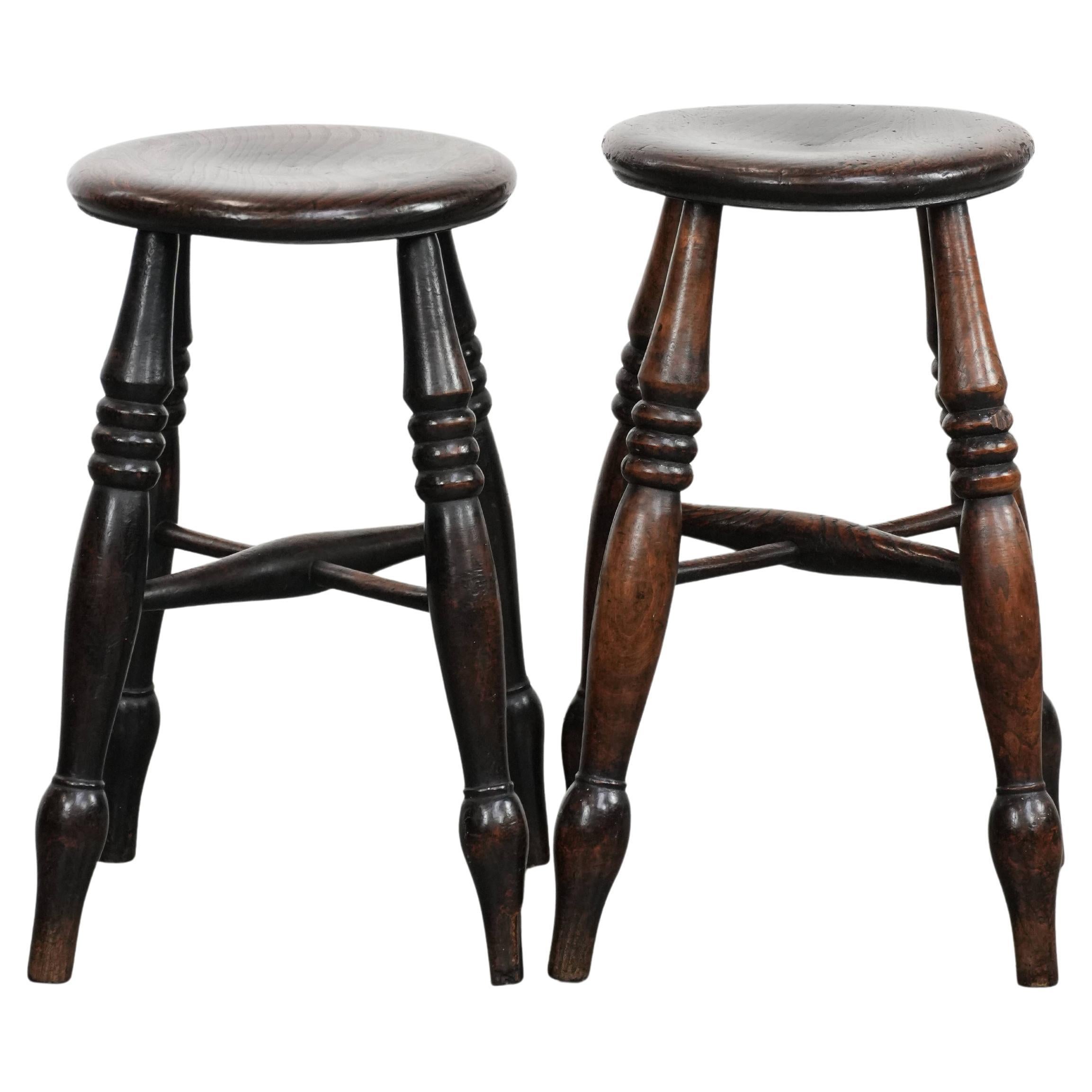 Set of two timeless antique English Windsor stools from the 18th century