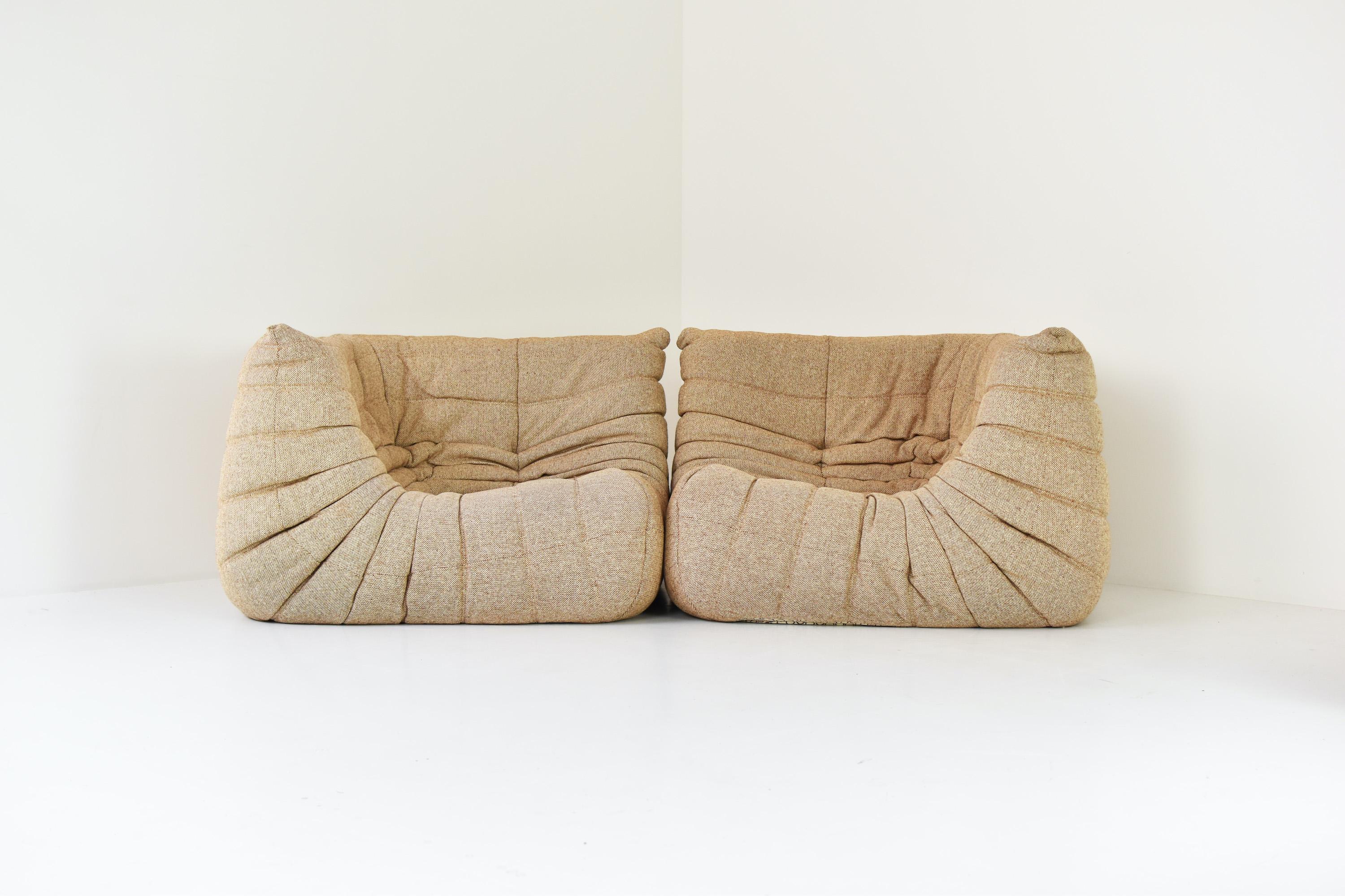 Set of two ‘Togo’ corner seaters designed by Michel Ducaroy for Ligne Roset, France 1960’s. This iconic sofa is completely made out of foam and features the original wool fabric upholstery. Labeled on the side. Extremely good original condition.