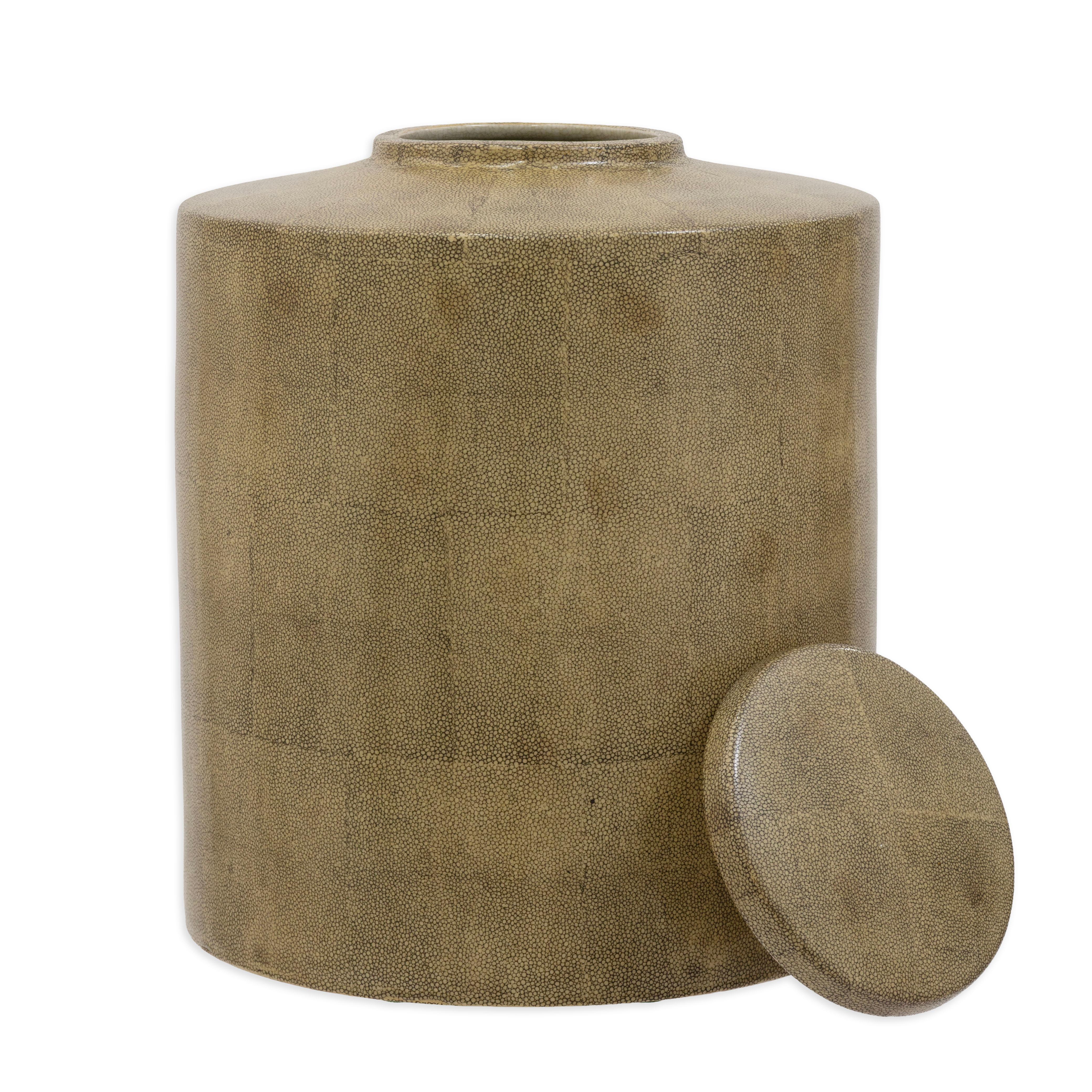 This striking pair of large lidded vessels by Tozai showcases a refined modern aesthetic enhanced by a richly textured faux-shagreen finish. Each vessel features a bold cylindrical form with a gently tapered shoulder and a perfectly fitted circular