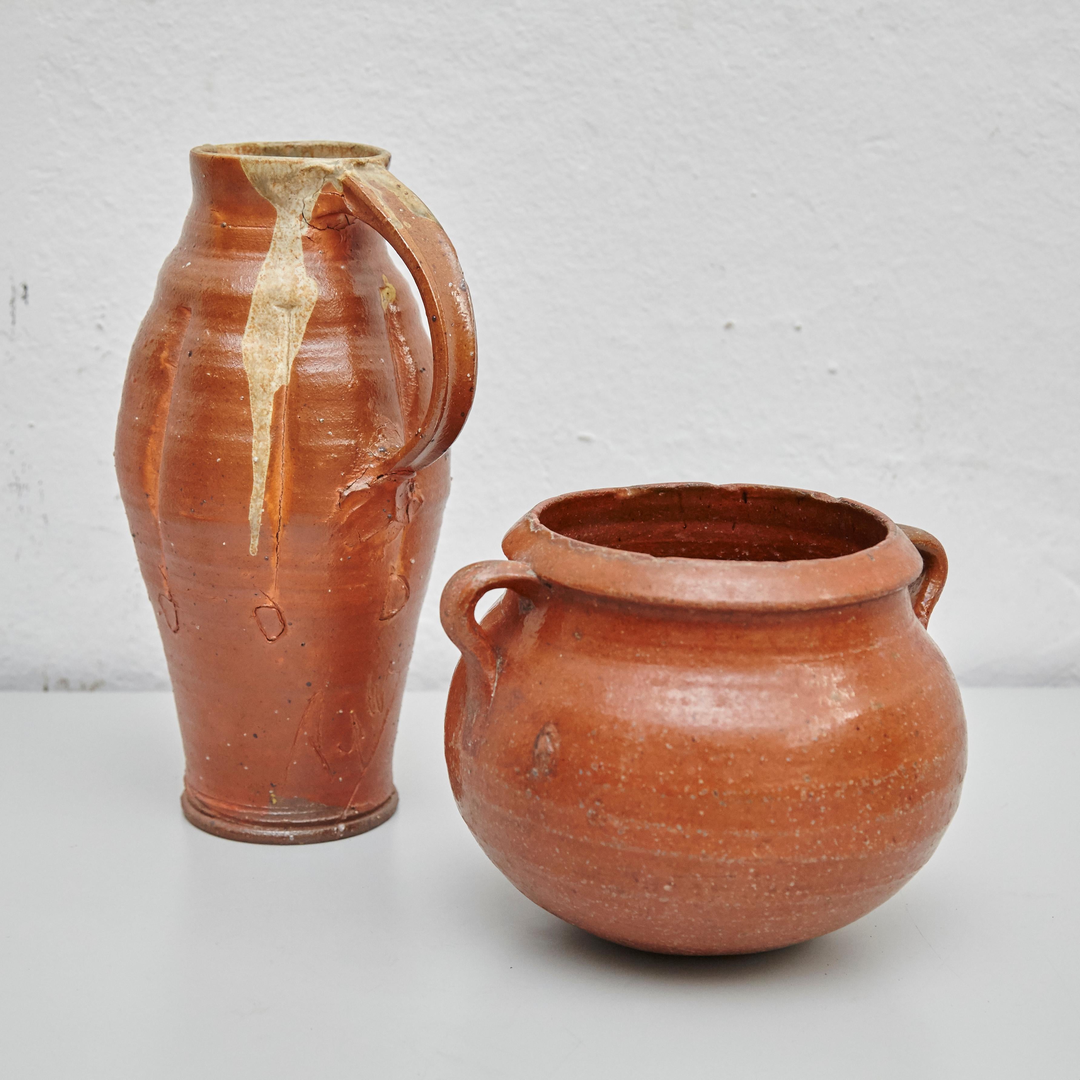 Set of two traditional Spanish ceramics.
Manufactured in Spain, circa 1970.

In original condition, with minor wear consistent with age and use, preserving a beautiful patina.

Measures: 20 cm diameter x 17 cm height
19 cm D x 16 cm W x 32cm H.
