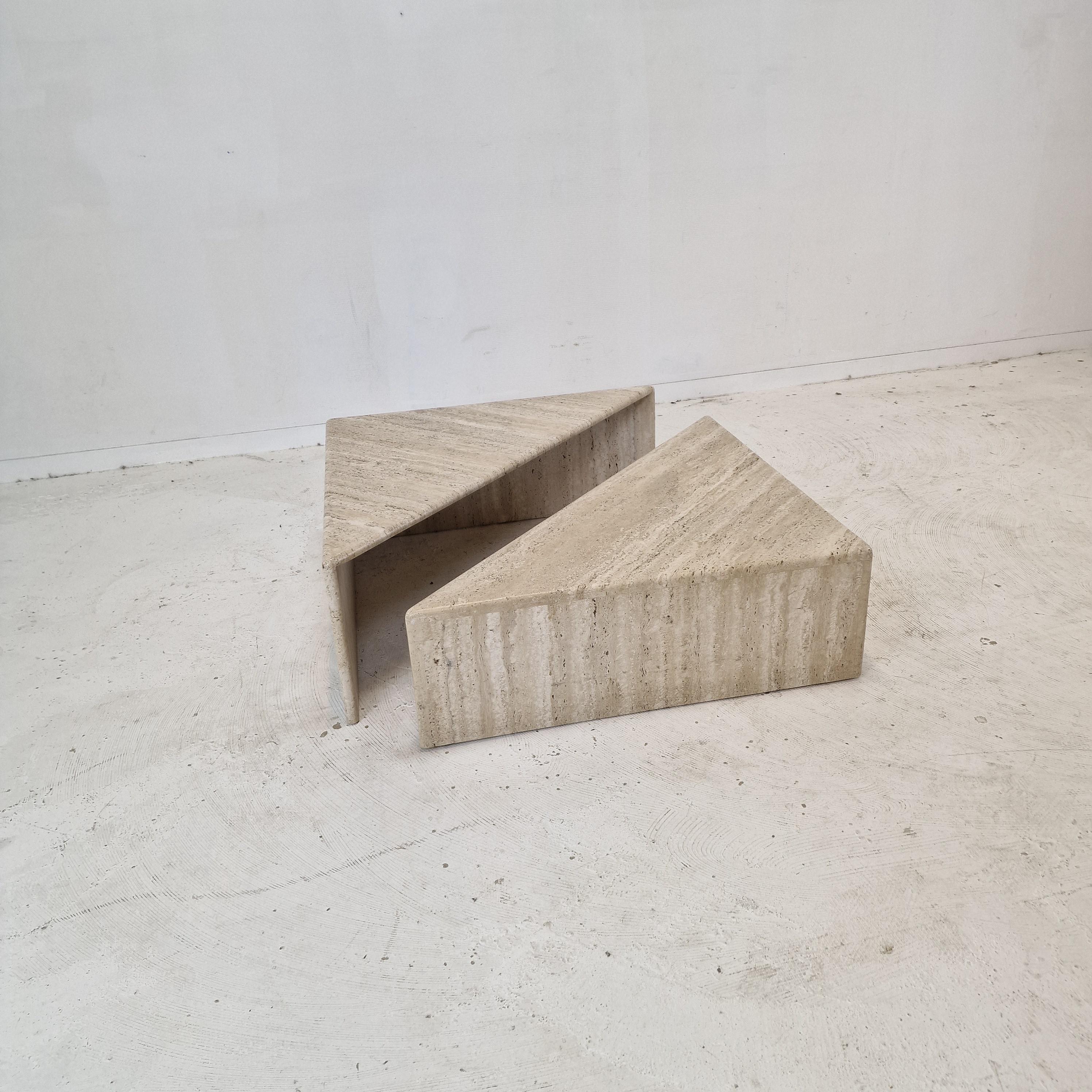 Very nice set of 2 triangle shaped Italian coffee or side tables by Up & Up, 1980's.

It is made of beautiful travertine. 
Please take notice of the very nice patterns. 

Can be used as one table together or as two separate tables.  

Dimensions per