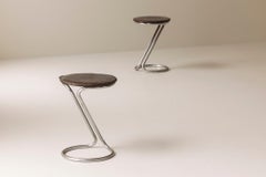 Set of two tubular chrome stools with rich patinated seats, 1940s