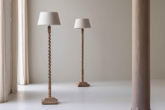 Set of two twisted oak floor lamps from France, dating from the 1950s.