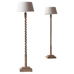 Set of two twisted oak floor lamps from France, dating from the 1950s. Set of two twisted oak floor lamps from France, dating from the 1950s.