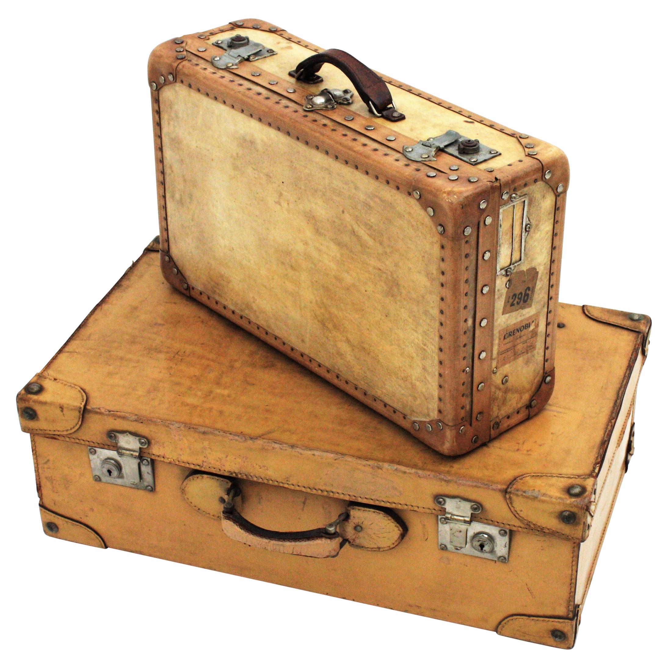 Unmatching Pair of French Suitcases in Vellum and Leather