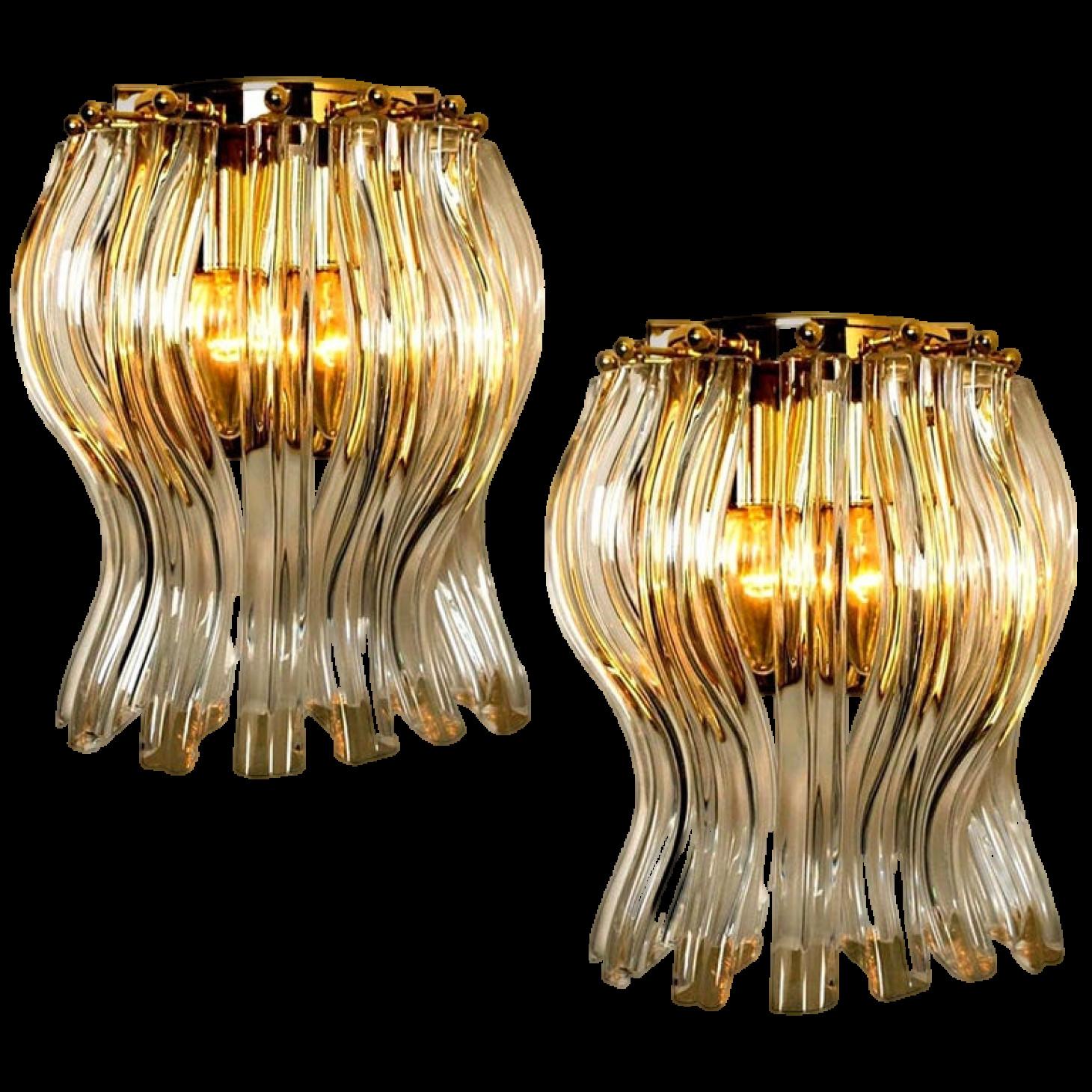 Beautiful pair of Murano glass wall sconces featuring four crystal clear glass 