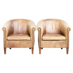 Conjunto de dos sillones club vintage de cuero de vaca de estilo inglés