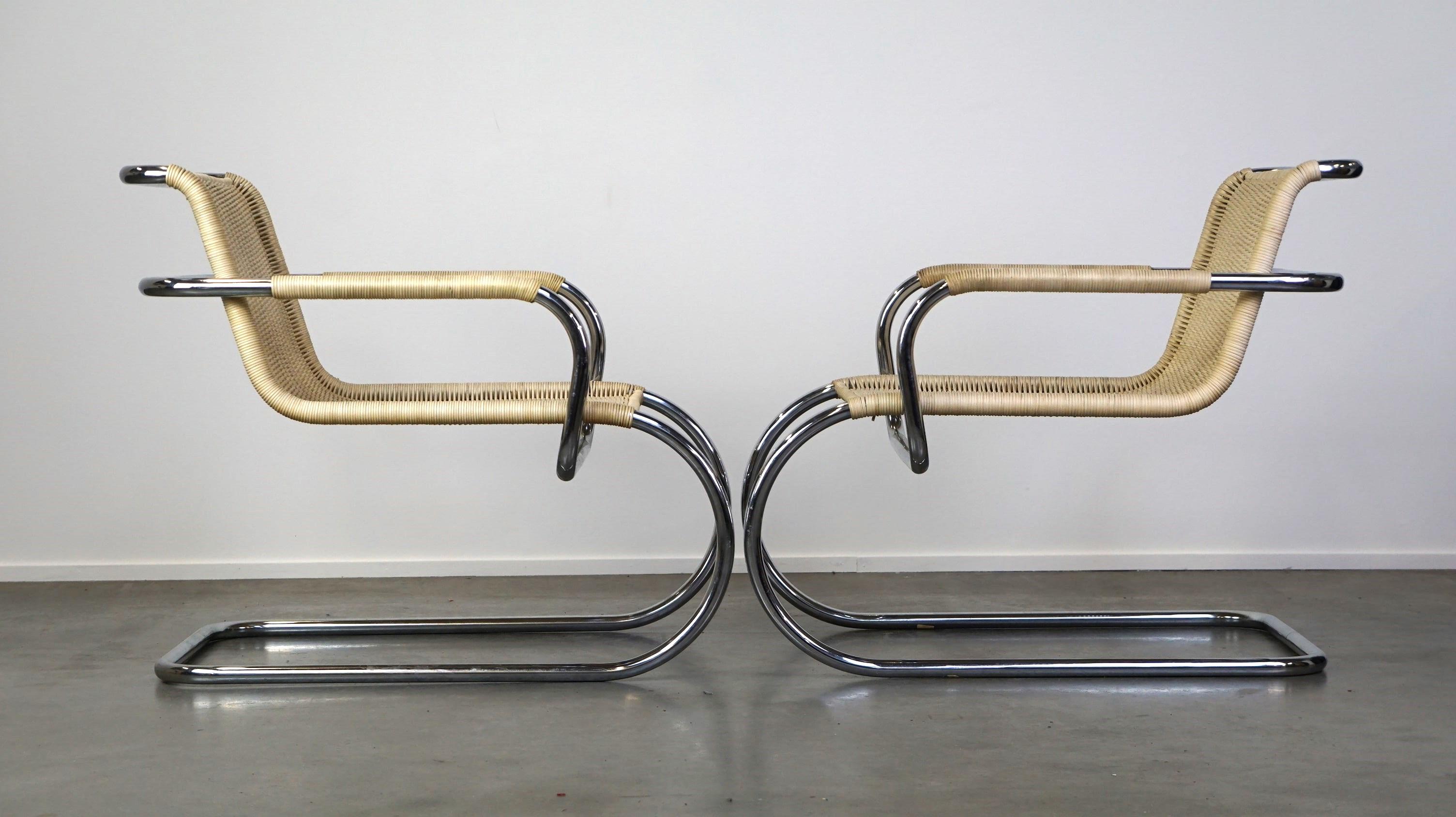 These stylish vintage set of design armchairs by Franco Albini for Tecta are not only attractive to look at due to their unique design but also comfortable to sit in, partly because they can rock. The frame is made of gracefully curved chrome tubes