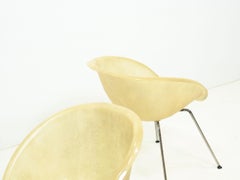 Set of two vintage fiber glass shell chairs