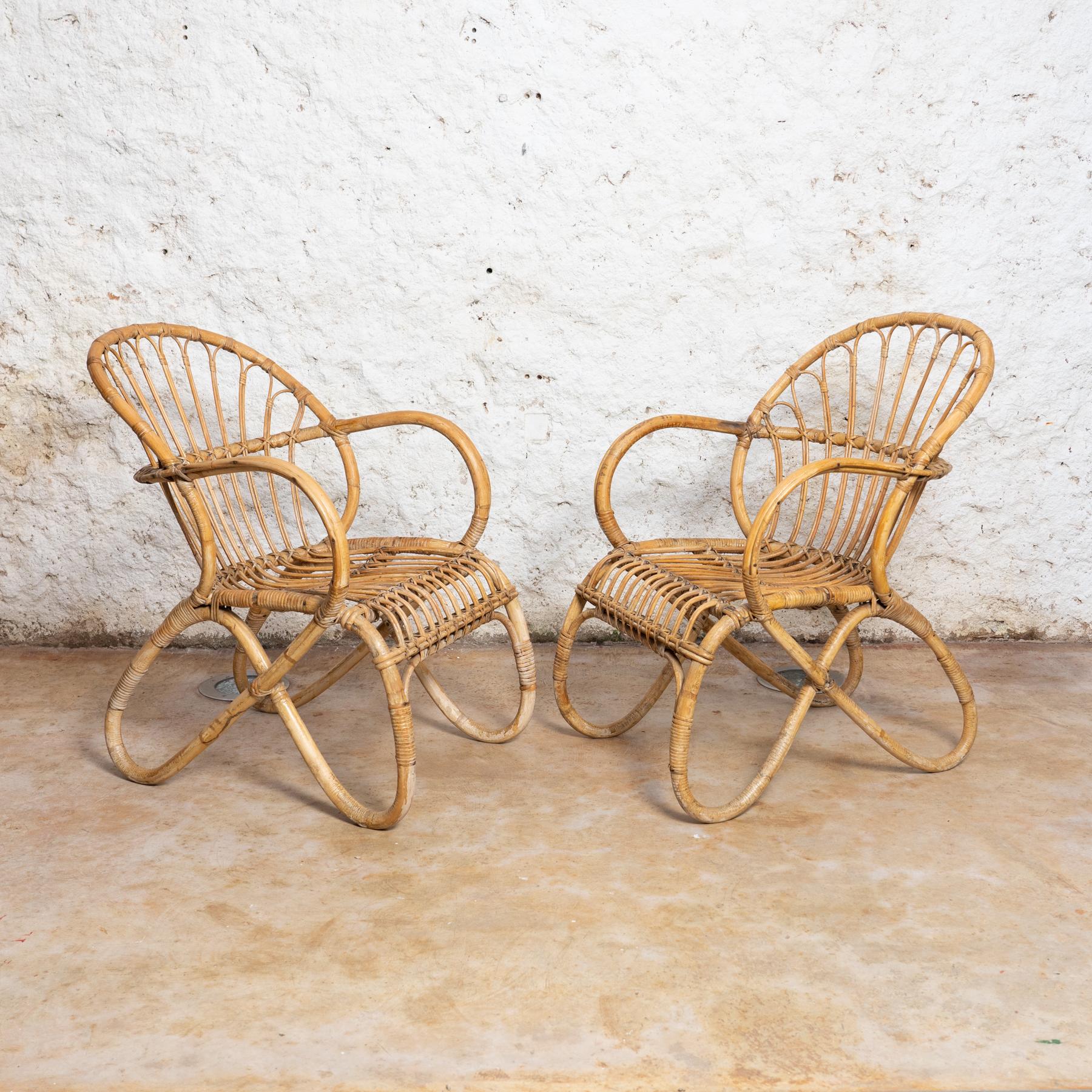 Set of two Armchairs by unknown manufacturer from France, circa 1960.

In original condition, with minor wear consistent with age and use, preserving a beautiful patina.

Material:
Bamboo.

   