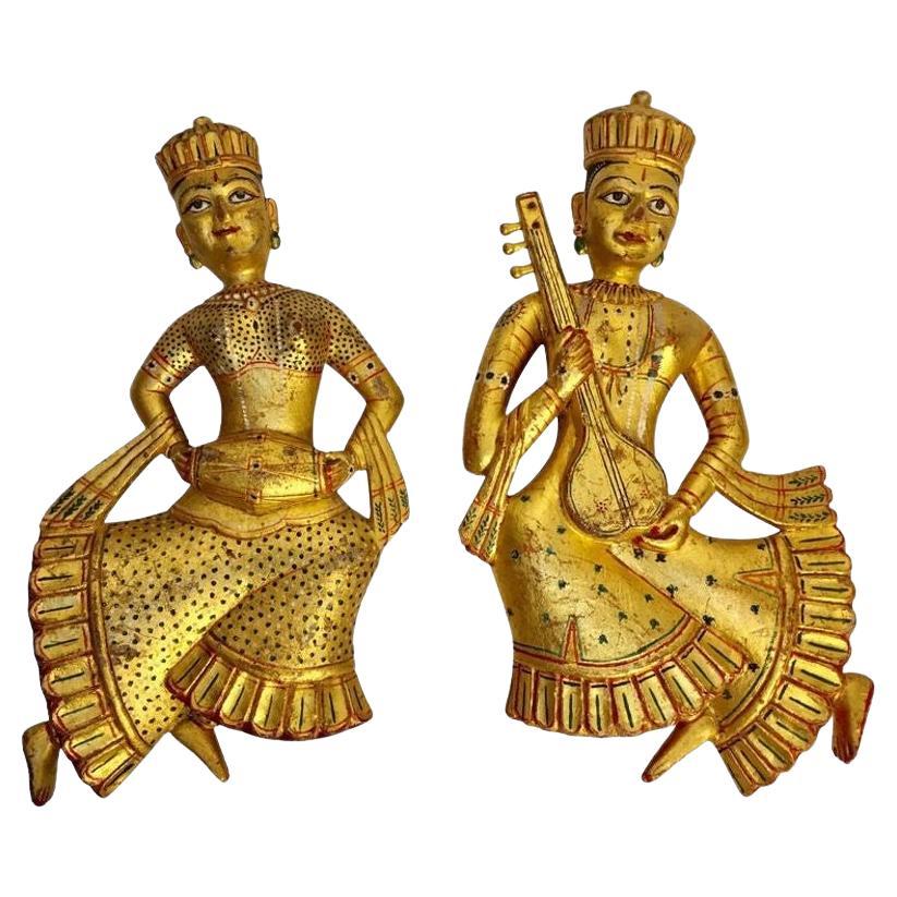 Set of two vintage Indian carved wood gilded hand carved wood wall hanging hand carved wood Rajasthani traditional female musicians sculptures.
Wall decor gilt wood raj sculptures, hand carved from a very dense wood with high and low relief detail.