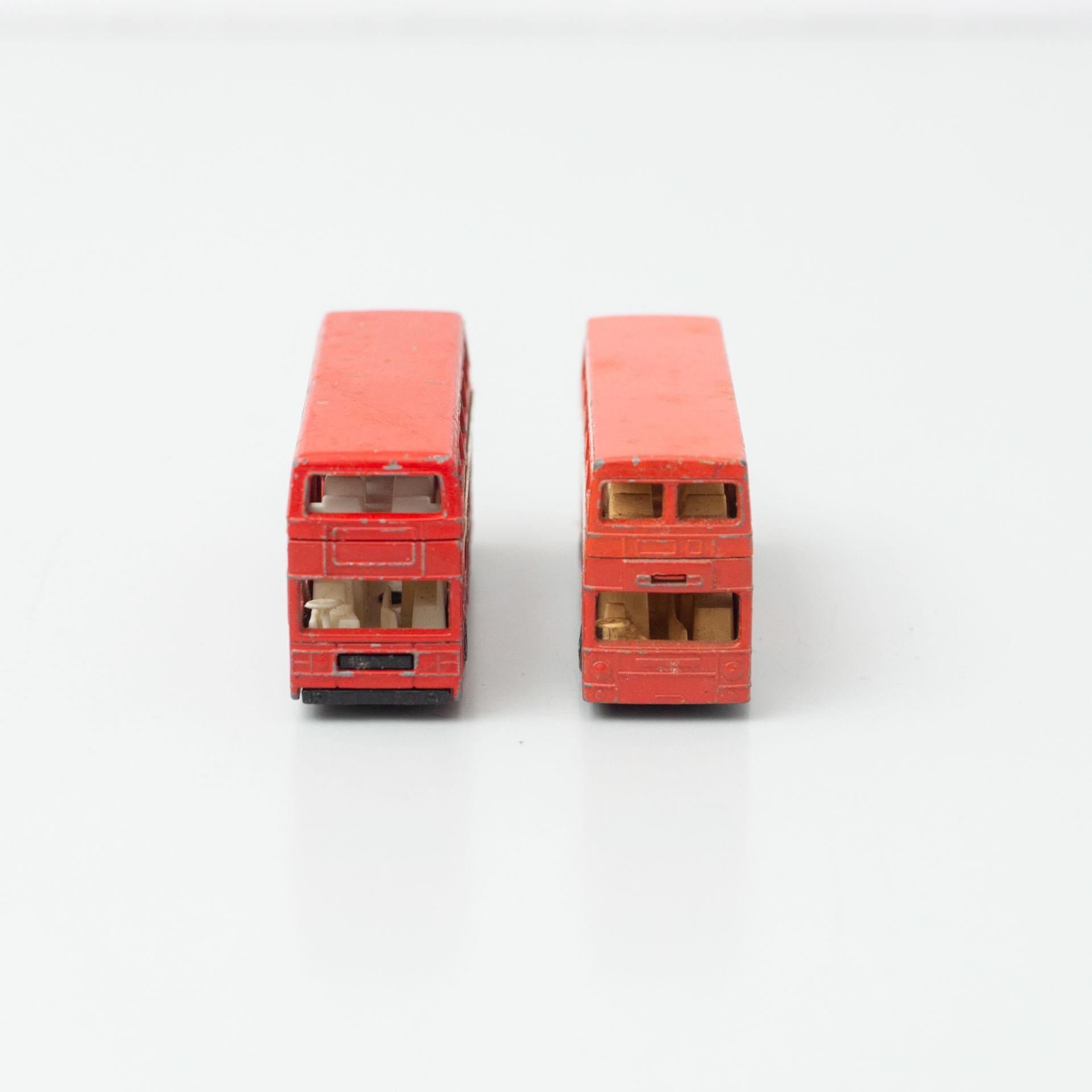 Set of two vintage London match box car bus toys.
By unknown manufacturer, circa 1960.

In original condition, with minor wear consistent with age and use, preserving a beautiful patina.

Materials:
Metal
Plastic

Dimensions (each one):
D