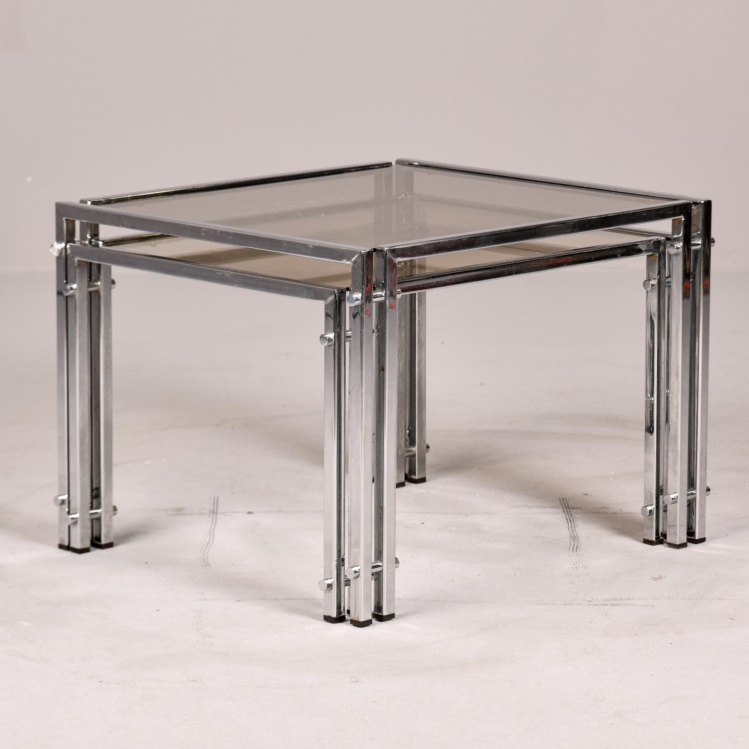 Italian Set of Two Vintage Nesting Tables with Chrome Frames and Pale Smoke Glass Tops For Sale