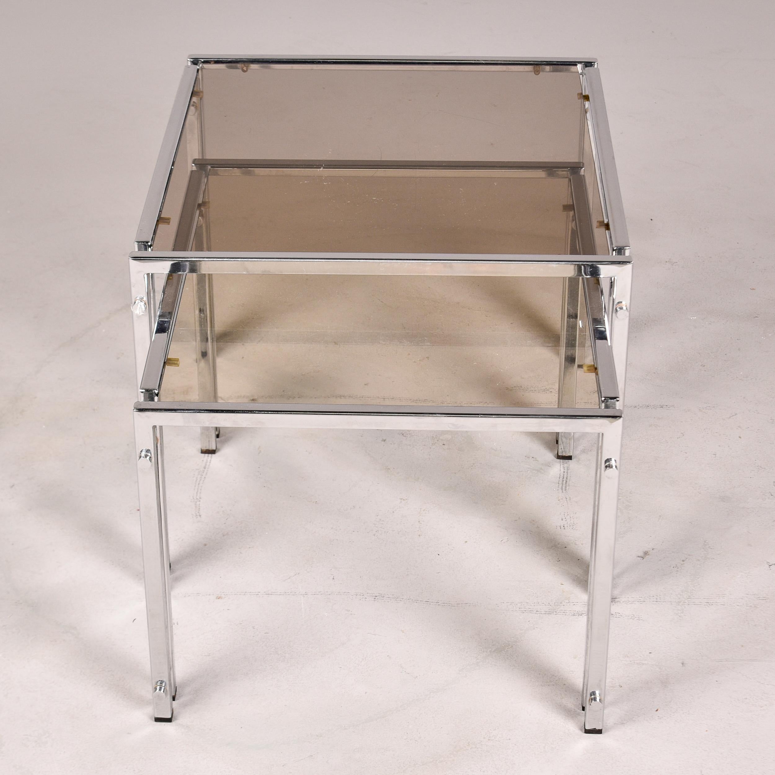 20th Century Set of Two Vintage Nesting Tables with Chrome Frames and Pale Smoke Glass Tops For Sale