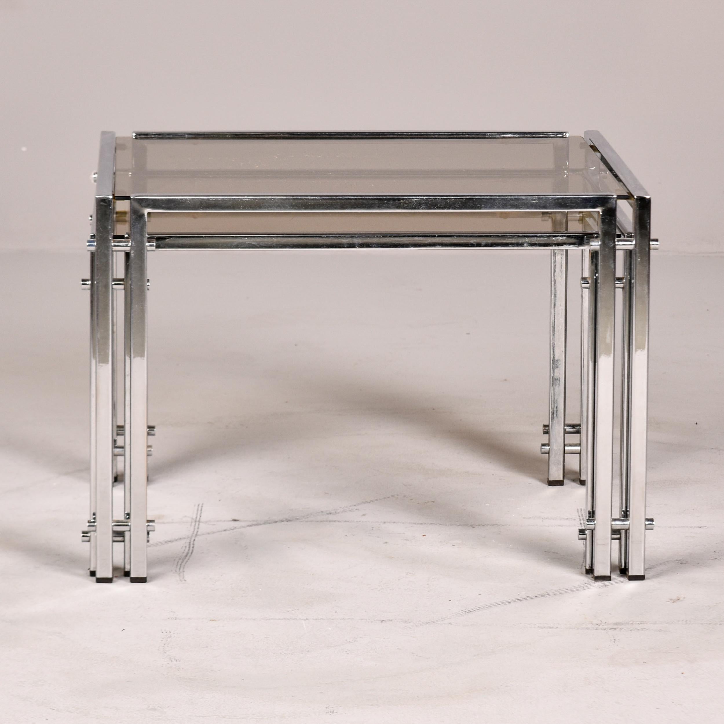 Smoked Glass Set of Two Vintage Nesting Tables with Chrome Frames and Pale Smoke Glass Tops For Sale