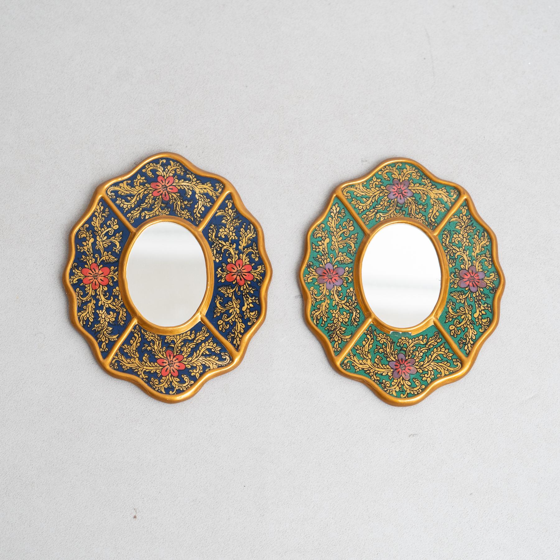 Set of Two Vintage Peruvian Mid-Century Hand-Painted Wooden Wall Mirrors.

Immerse yourself in the captivating charm of mid-century design with this remarkable collection of five hand-painted wooden wall mirrors, originating from 1960s Peru. Each