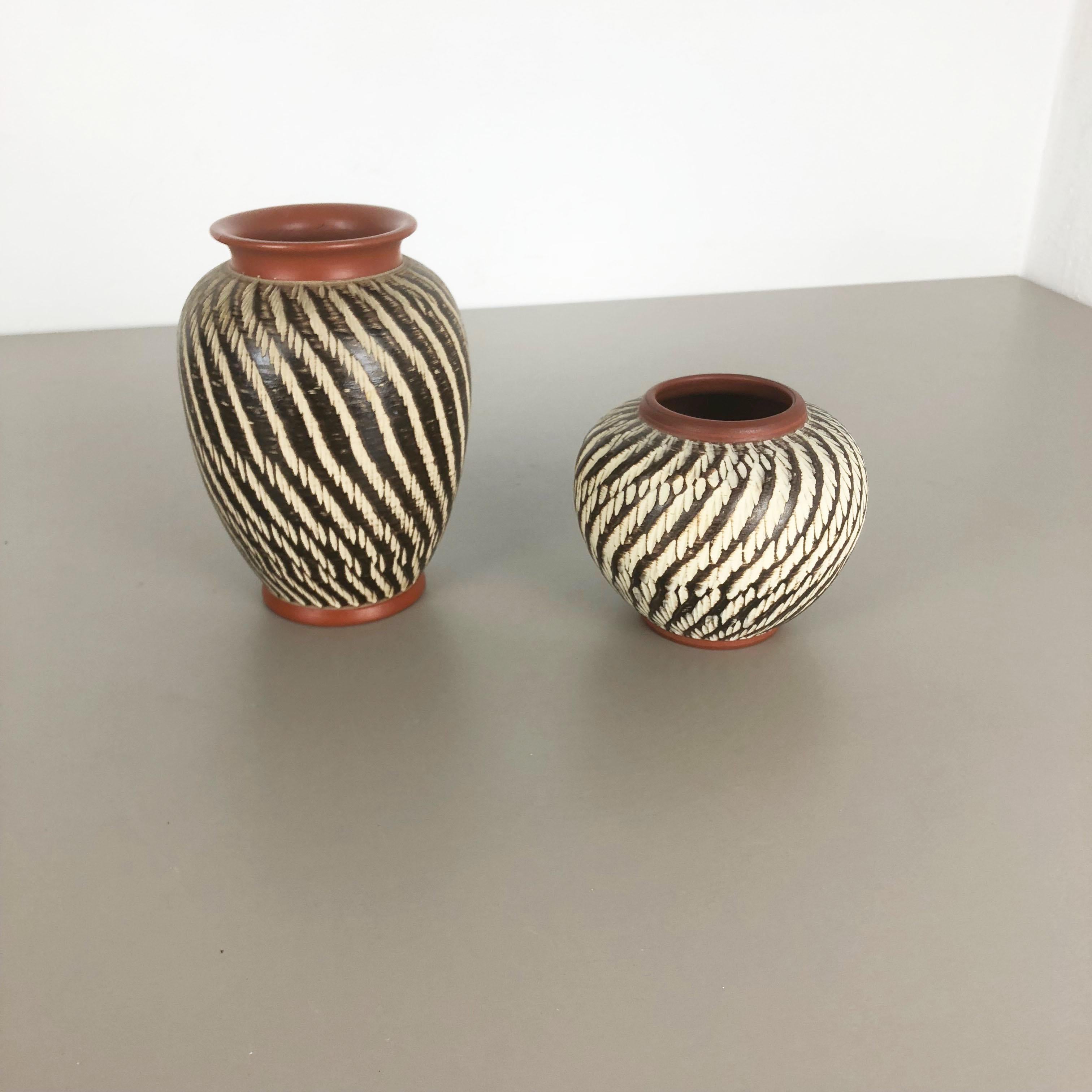 Article:

Set of two abstract vases



Producer:

WEKARA, Germany



Decade:

1960s


These original vintage vases was produced in the 1960s in Germany. It is made of ceramic pottery with abstract illustration, typical for the age