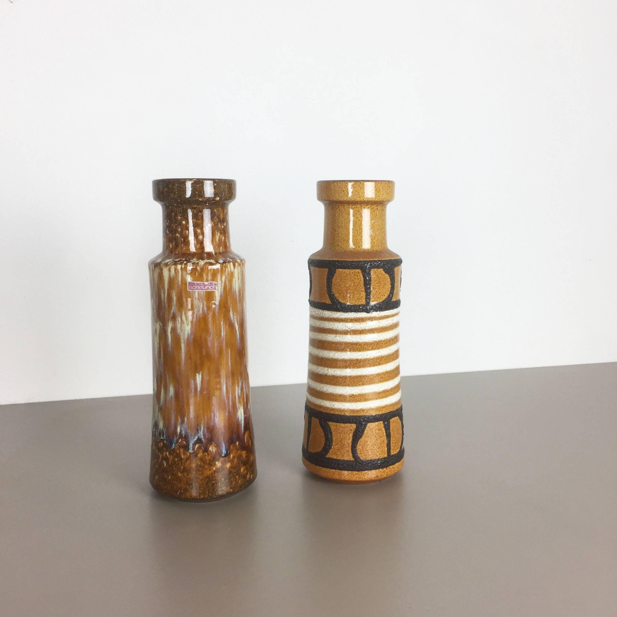 Article:

set of two Fat Lava art vases


Producer:

Scheurich, Germany


Design:

Nr. 205 32



Decade:

1970s


Description:

This original vintage Vase was produced in the 1970s in Germany. It is made of porcelain in Fat