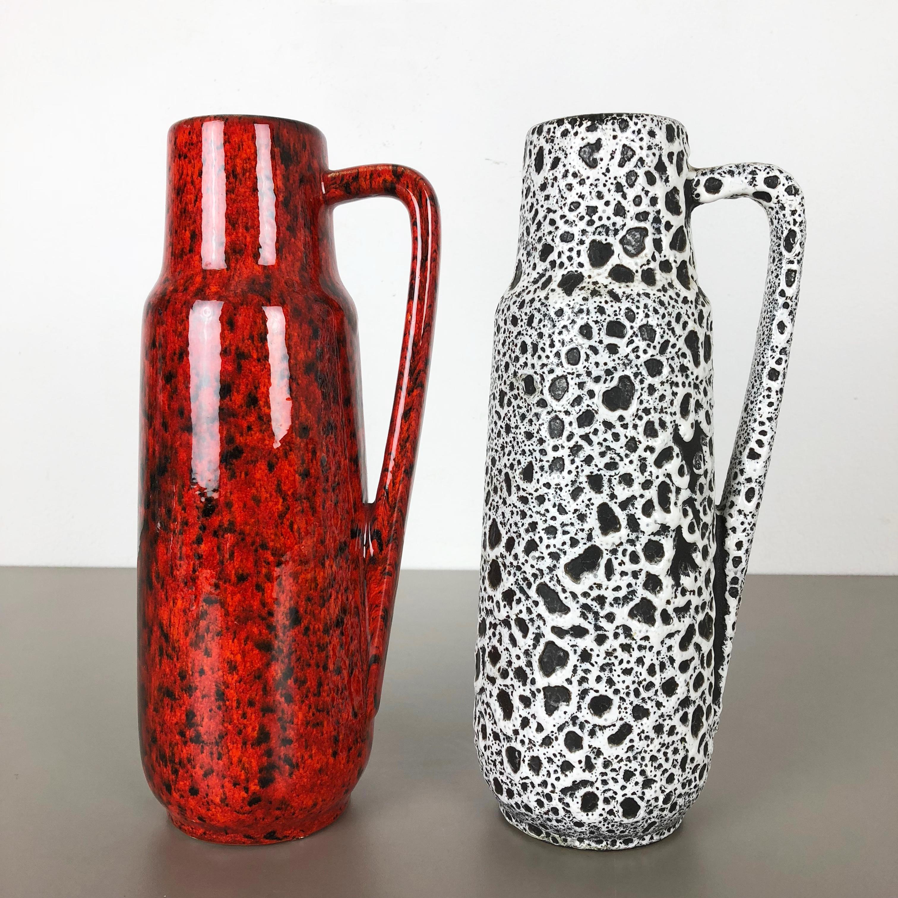 Article:

Set of two Fat Lava art vases


Producer:

Scheurich, Germany


Design:

Nr. 275 28



Decade:

1970s


Description:

This original vintage Vase was produced in the 1970s in Germany. It is made of porcelain in Fat