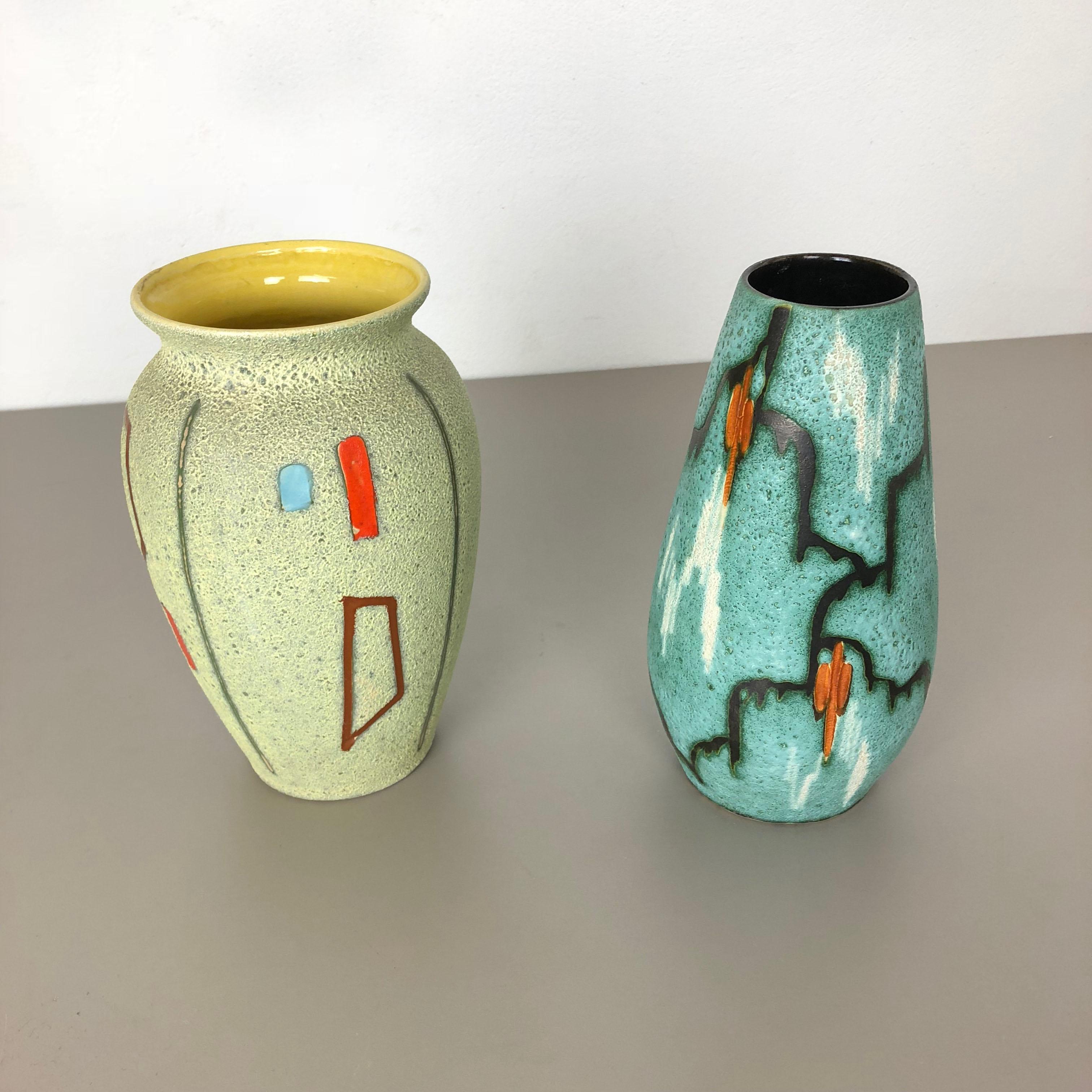 Article:

Set of two abstract colorful vases 



Producer:

Scheurich, Germany



Decade:

1960s


These original vintage vases was produced in the 1960s in Germany. It is made of ceramic pottery with abstract illustration, typical