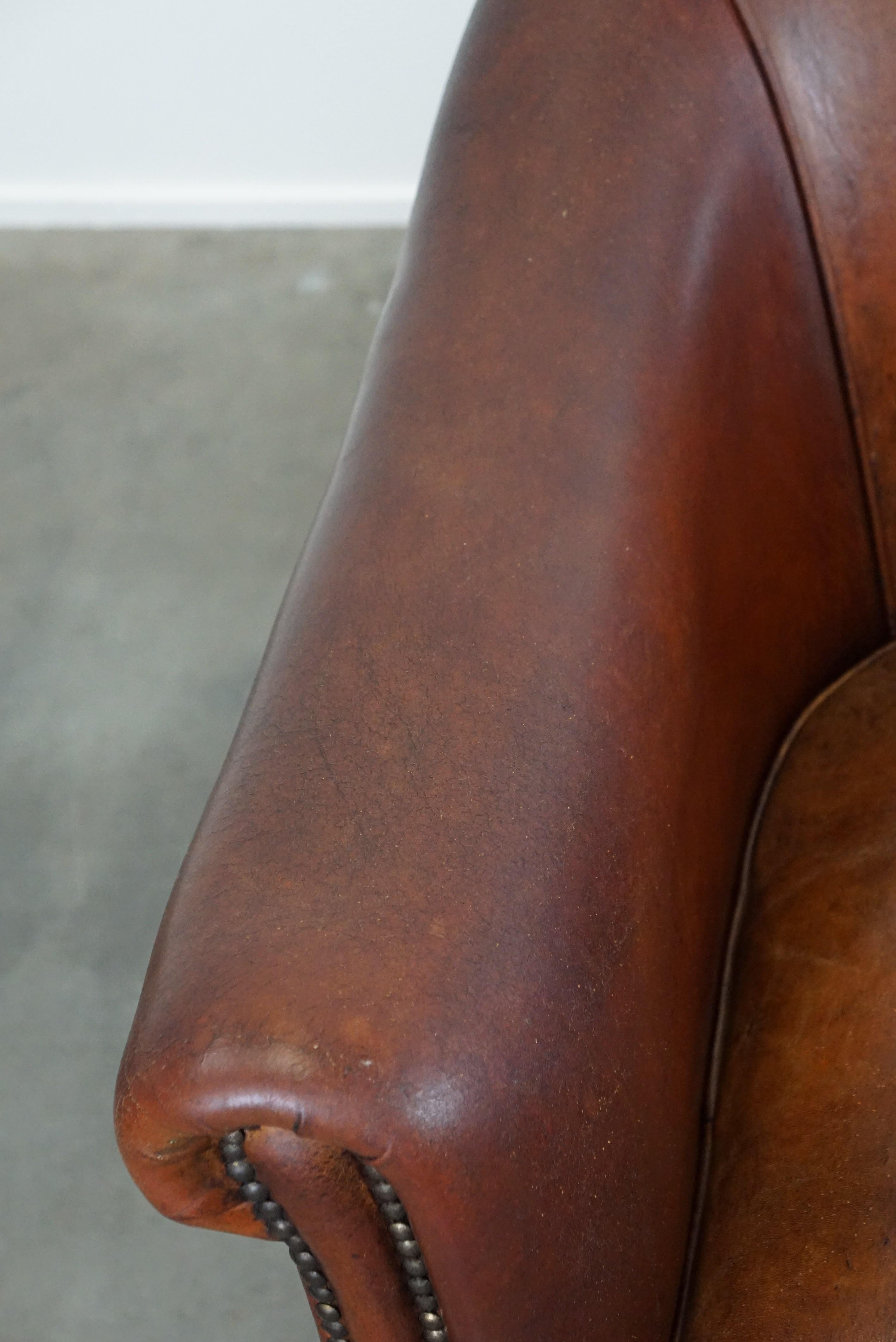 Set of two vintage sheep leather club armchairs with a rugged character For Sale 3