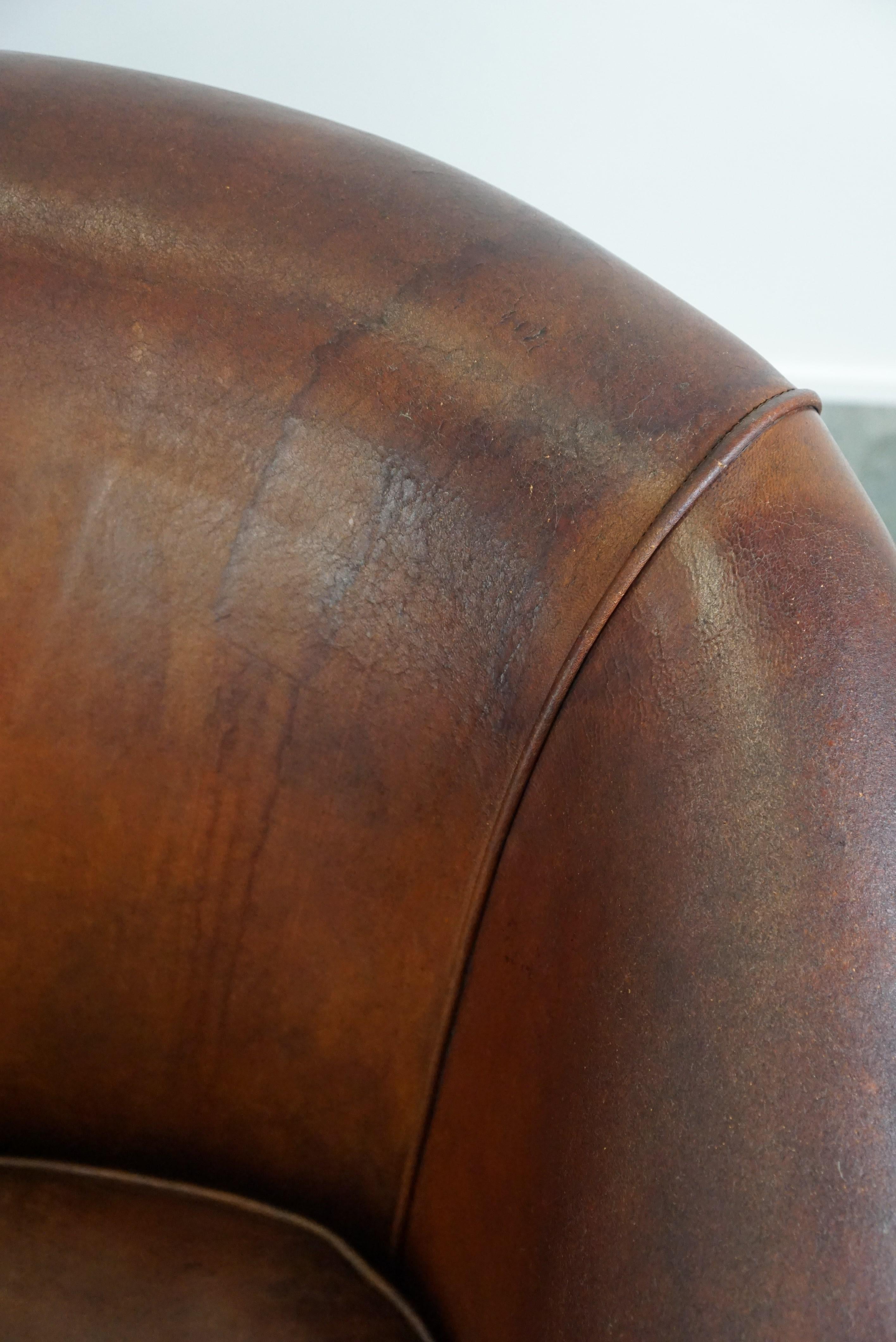 Set of two vintage sheep leather club armchairs with a rugged character For Sale 7